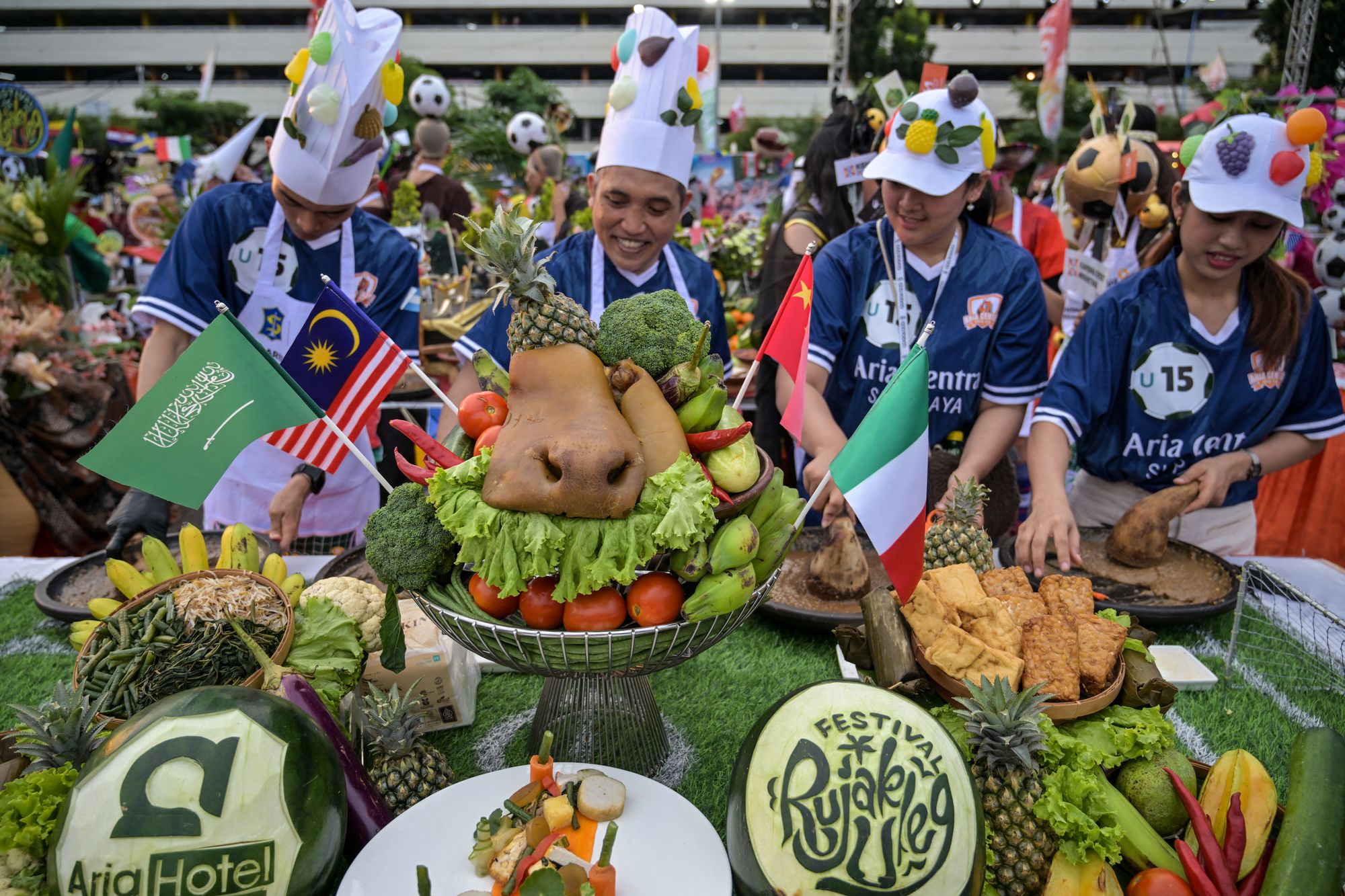 Food inspectors been dispatched to restaurants, food trucks and even temporary tents to ensure health standards are being followed. Pictured: Participants dressed in soccer uniforms take part in a festival in Indonesia to welcome the upcoming FIFA World Cup