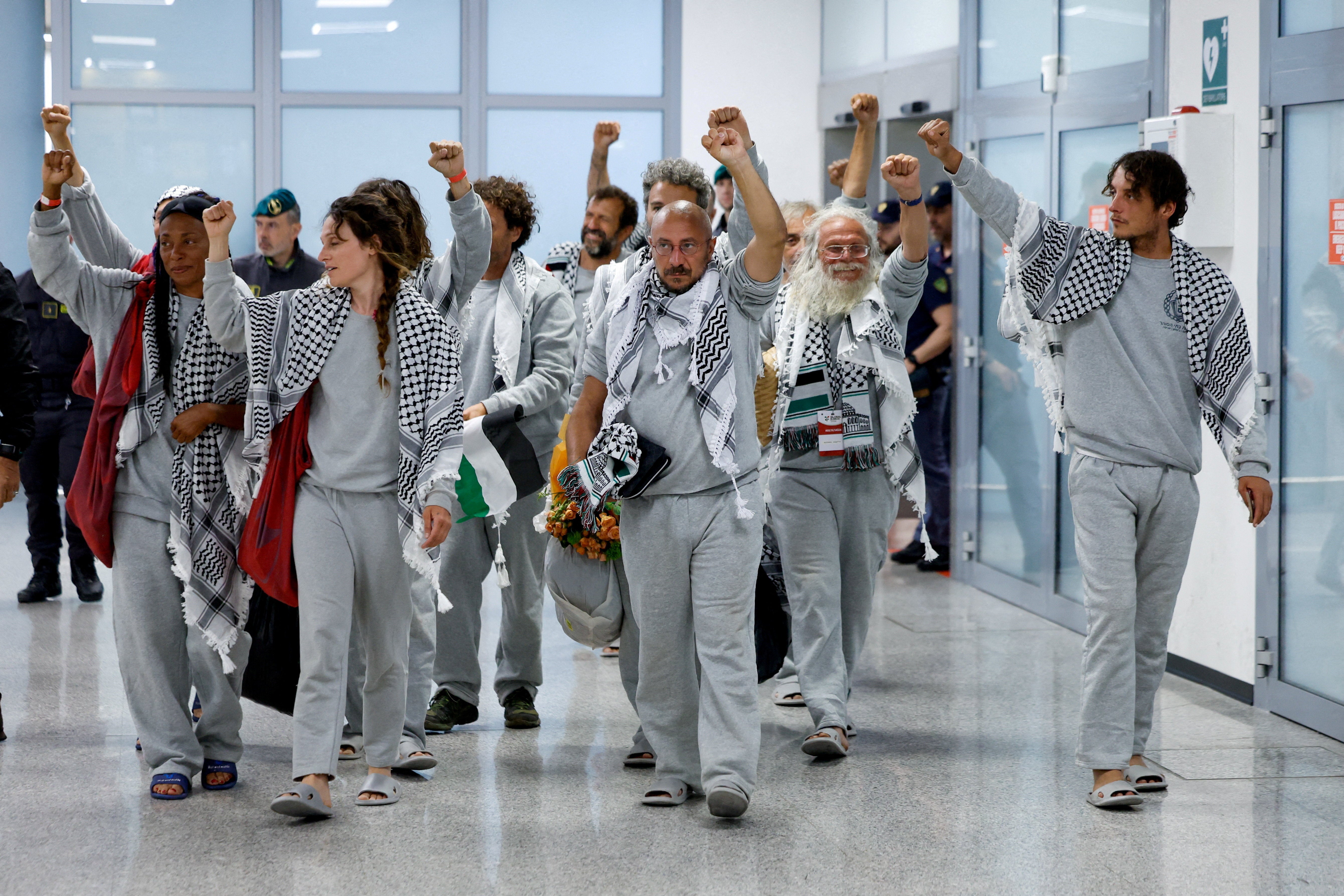 A group of Italian activists arrive at Fiumicino airport after their release