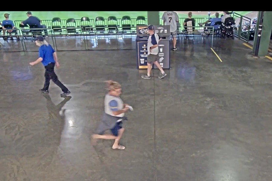 Security video shows Flynn racing to turn in her raffle ticket inside the American Family Field stadium