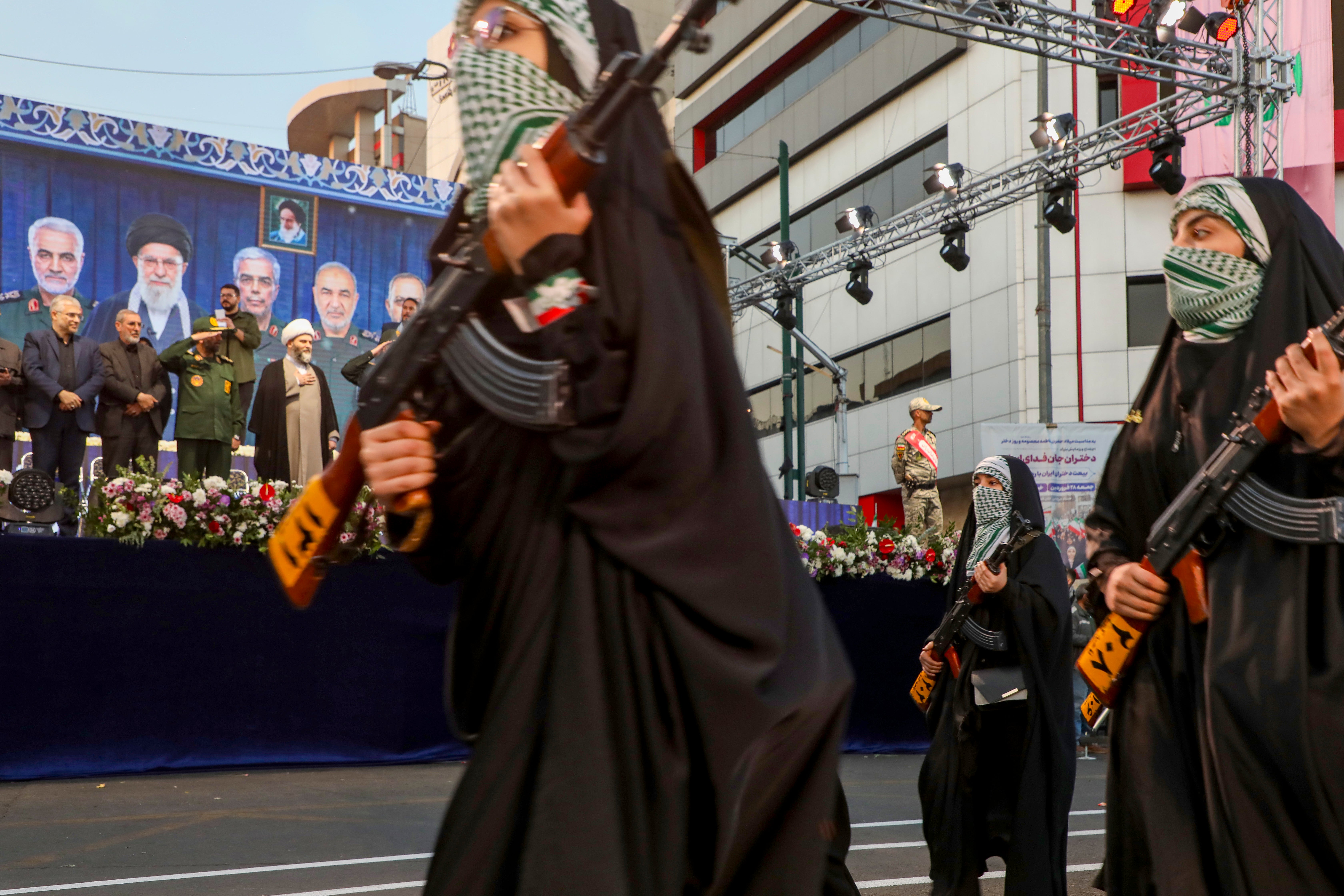Women hold rifles during a pro-government National Army Day demonstration on April 17, 2026 in Tehran, Iran. Anti-government protestors are in hiding, to scared to go home