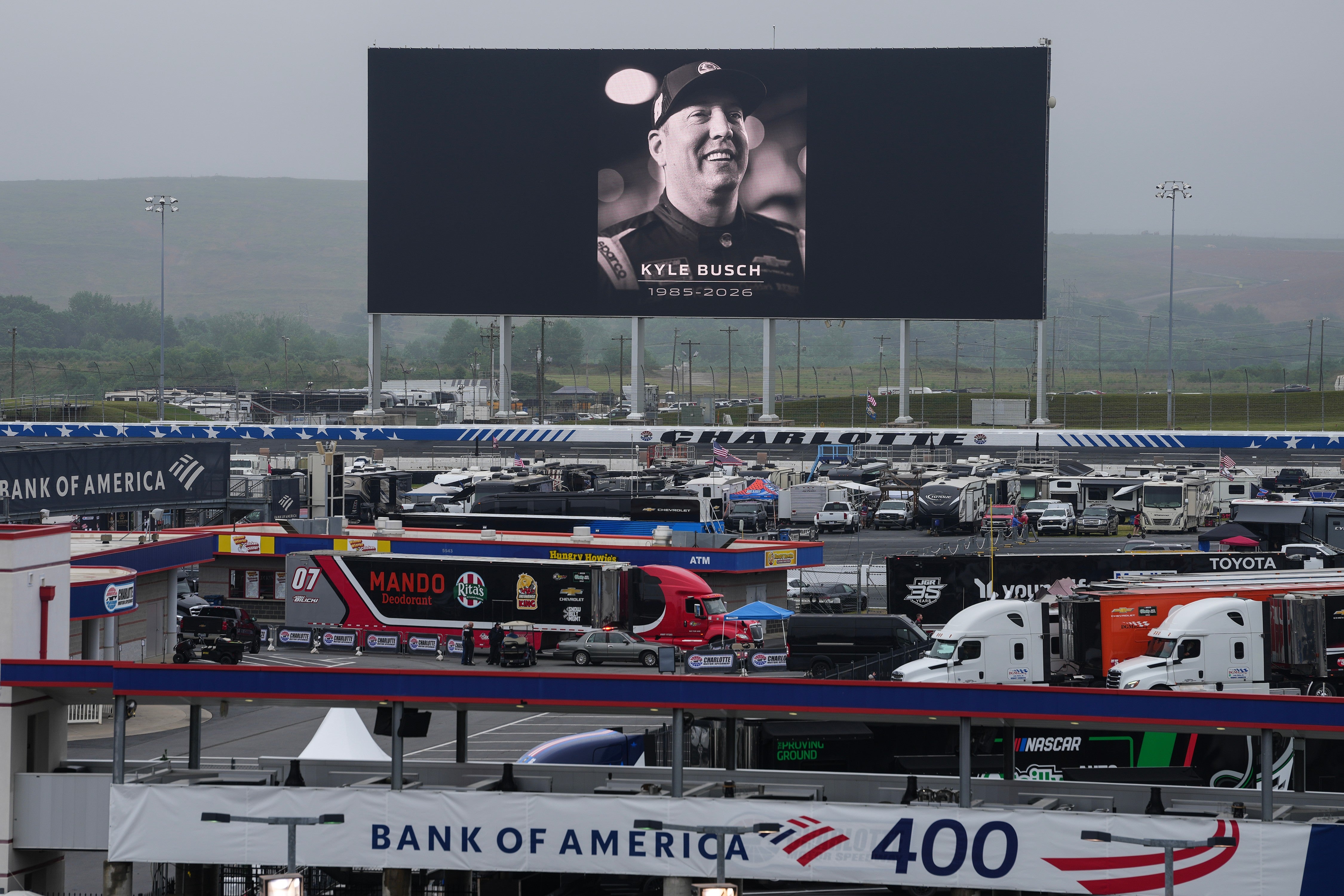 An in memoriam photo of former driver Kyle Busch is displayed on the video board of the backstretch at Charlotte Motor Speedway, Friday, May 22, 2026