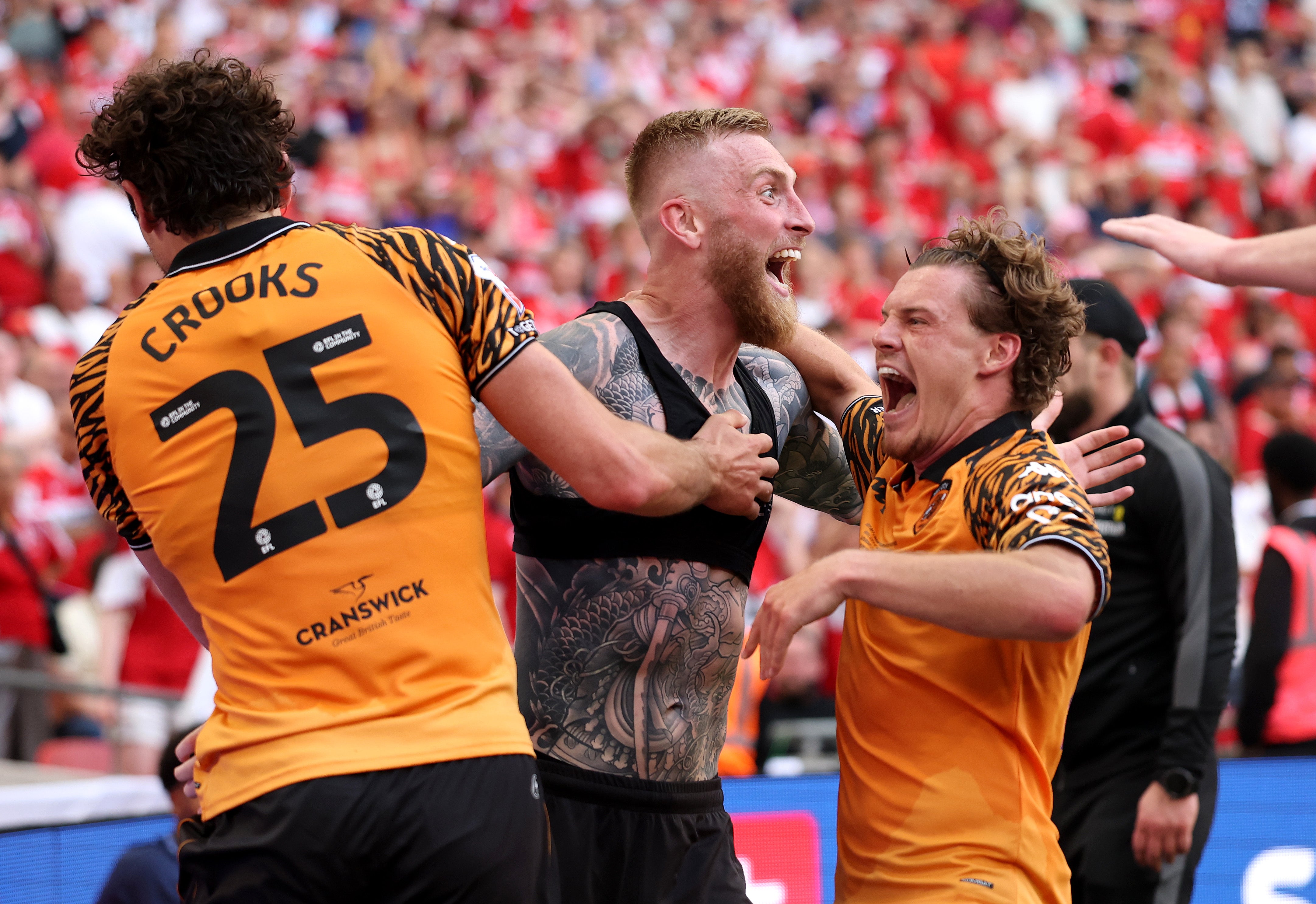 Oli McBurnie snatched a 95th minute winner to seal Hull promotion