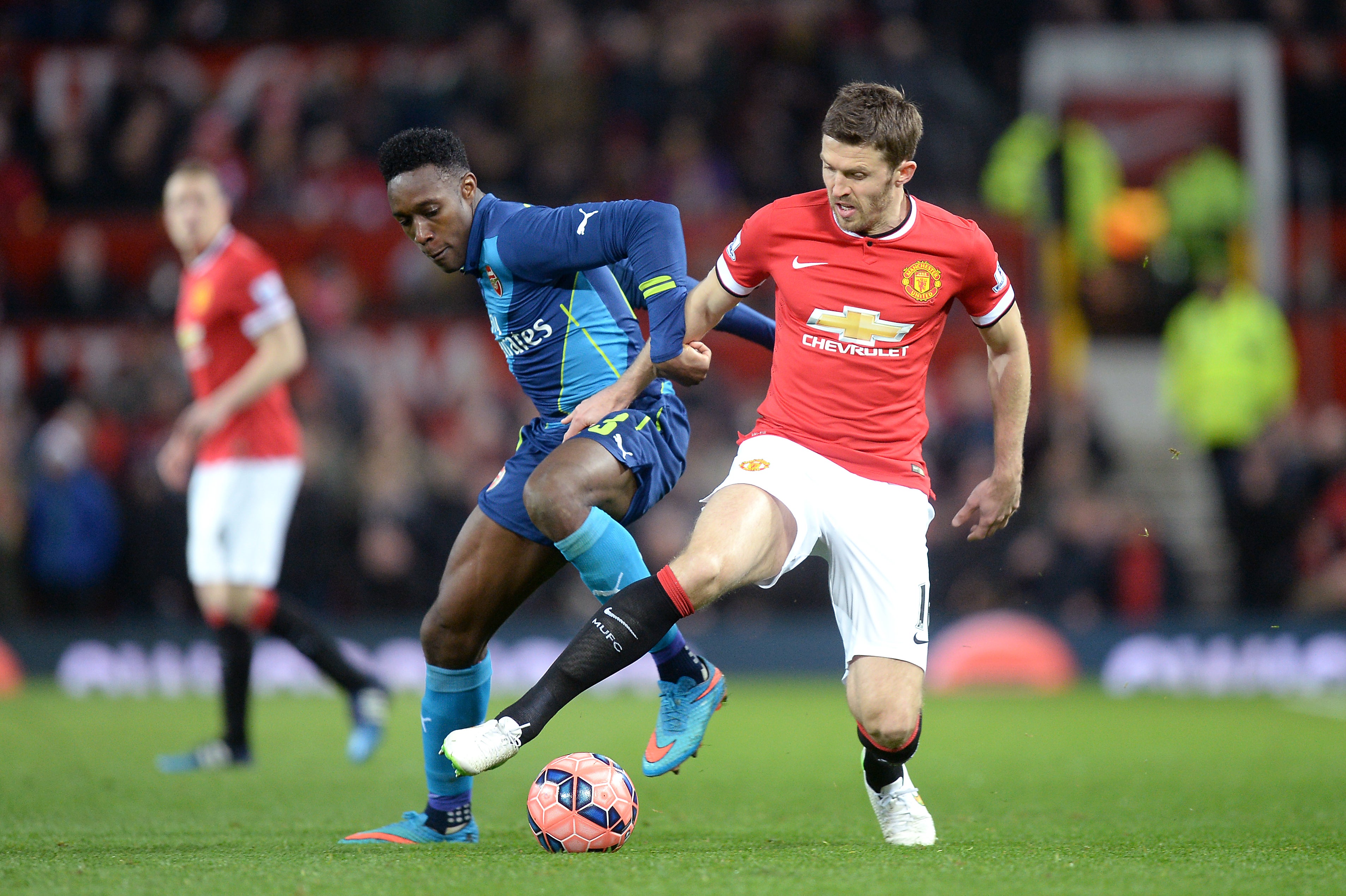 Carrick (right) and Danny Welbeck (left) battle for the ball (Martin Rickett/PA)