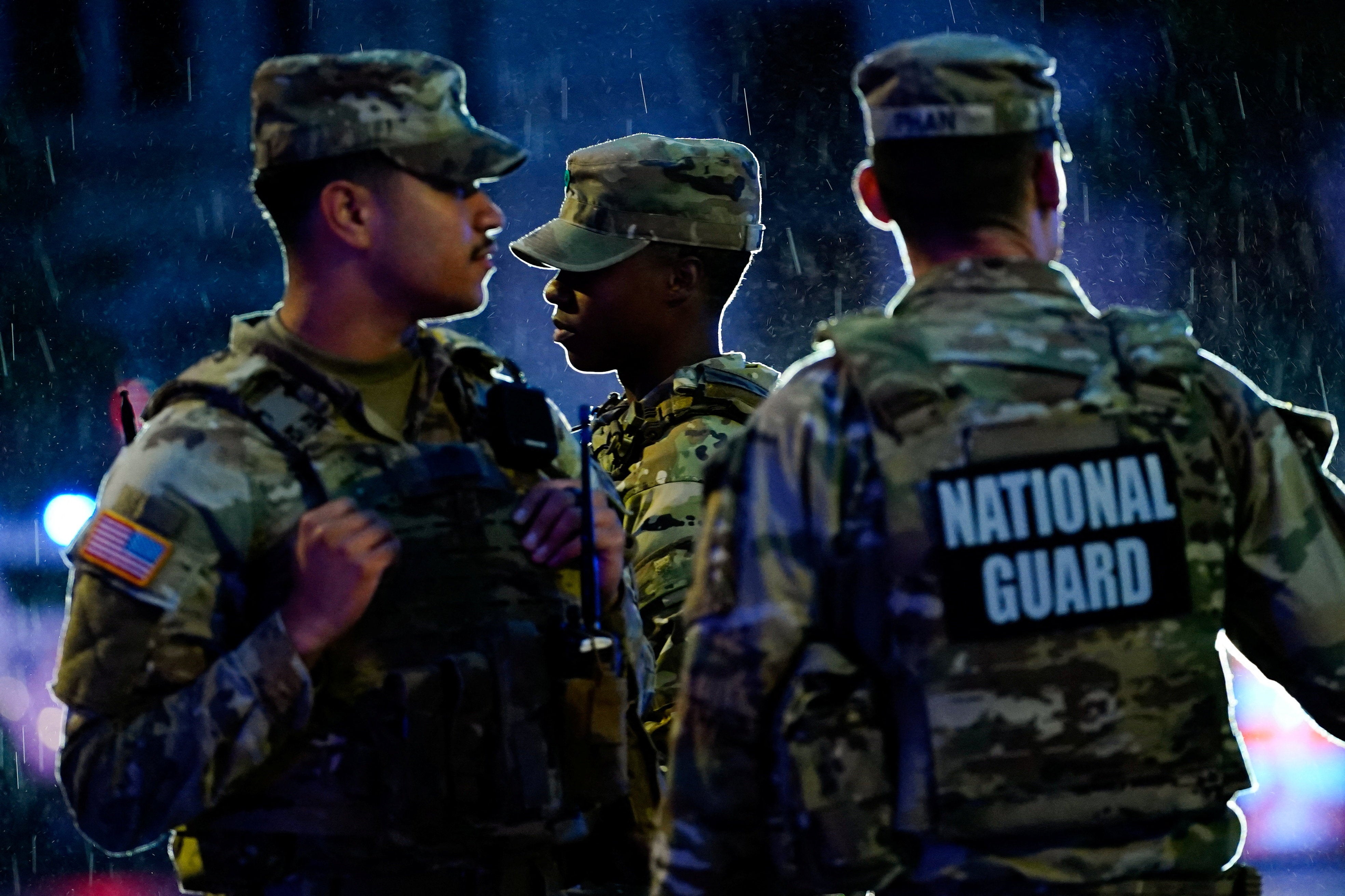 Members of the National Guard gather near the White House (Reuters)