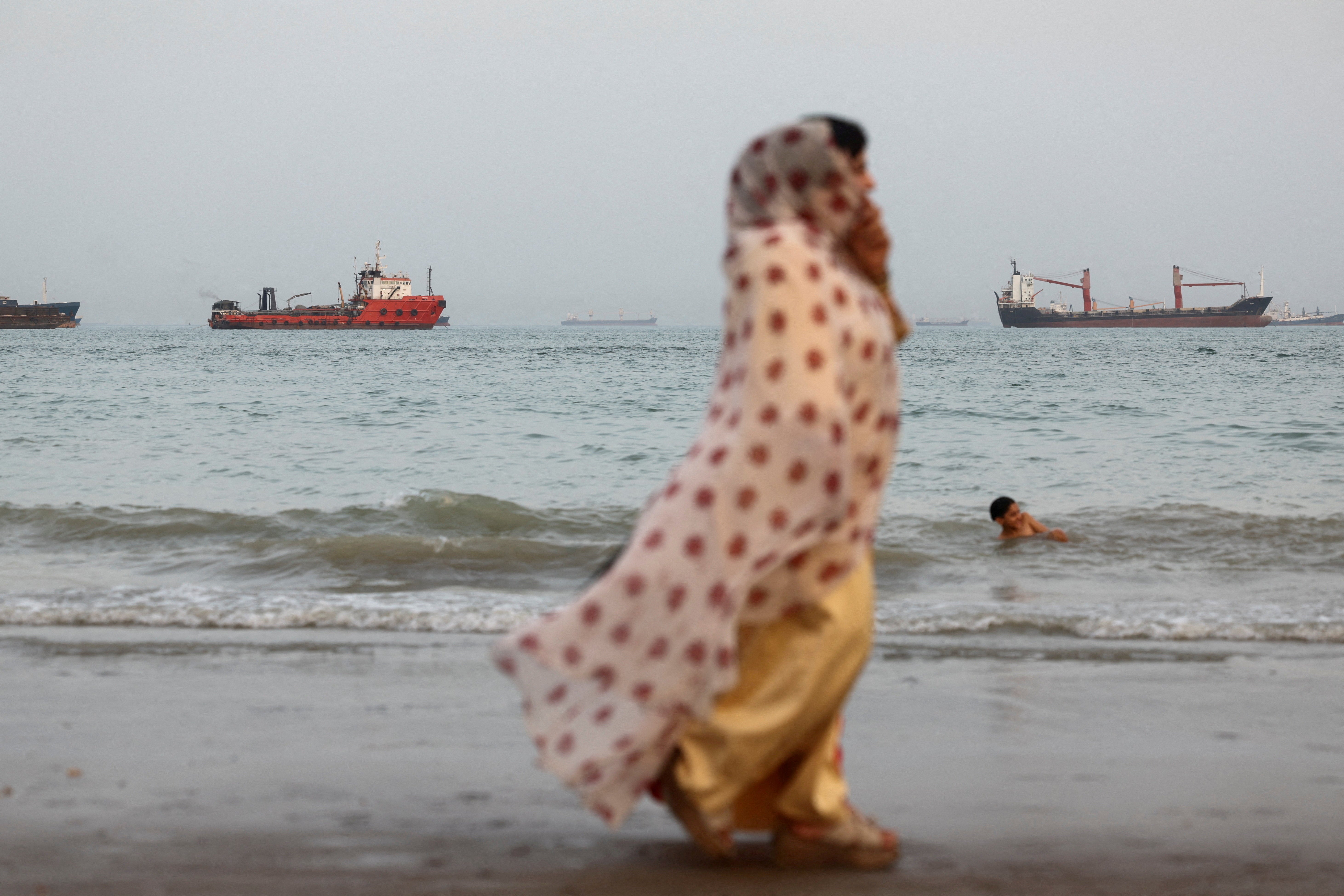 Vessels in the contentious Strait of Hormuz visible near the beach of Bandar Abbas