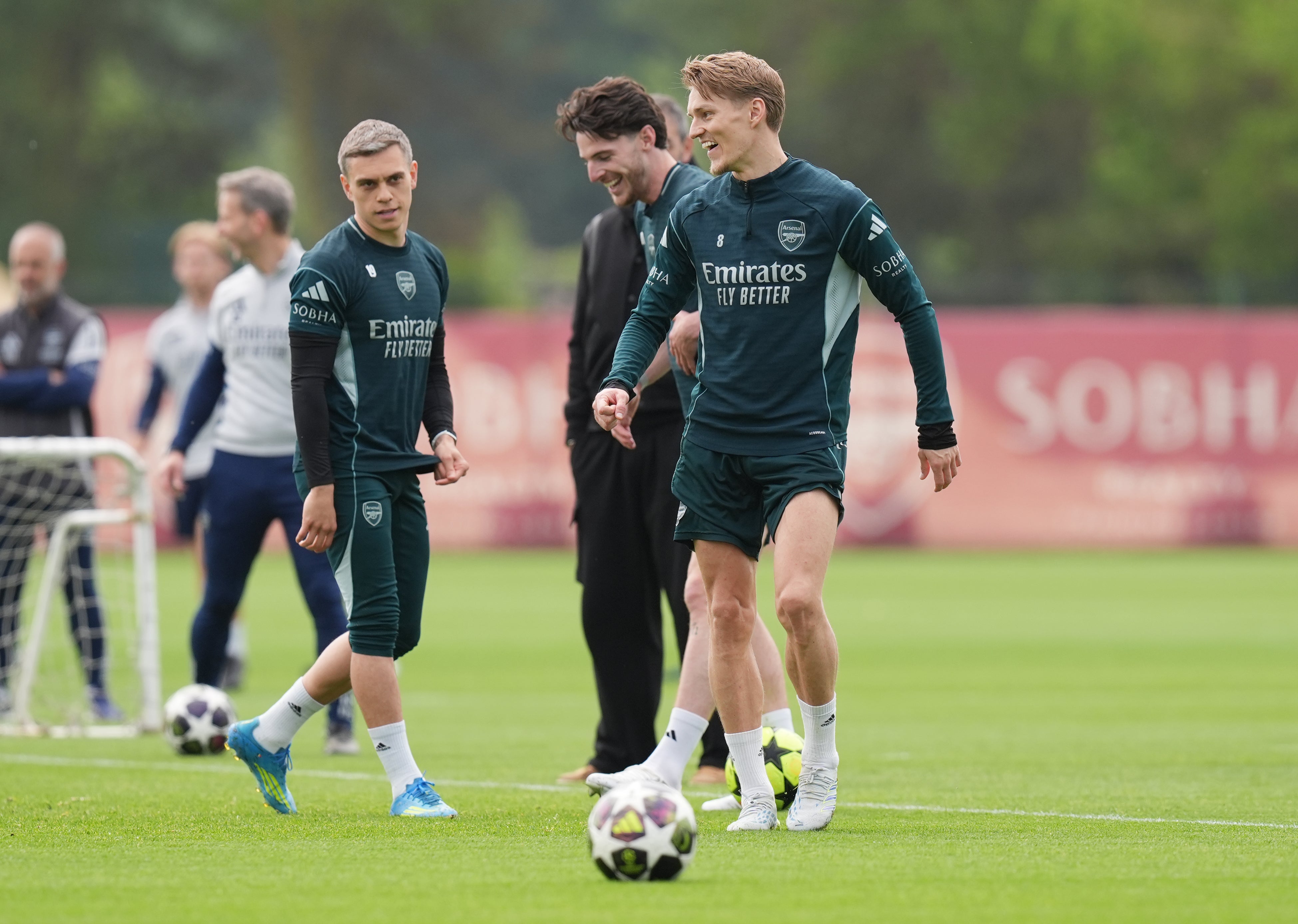 Arsenal's Martin Odegaard and Declan Rice during the training session (PA)