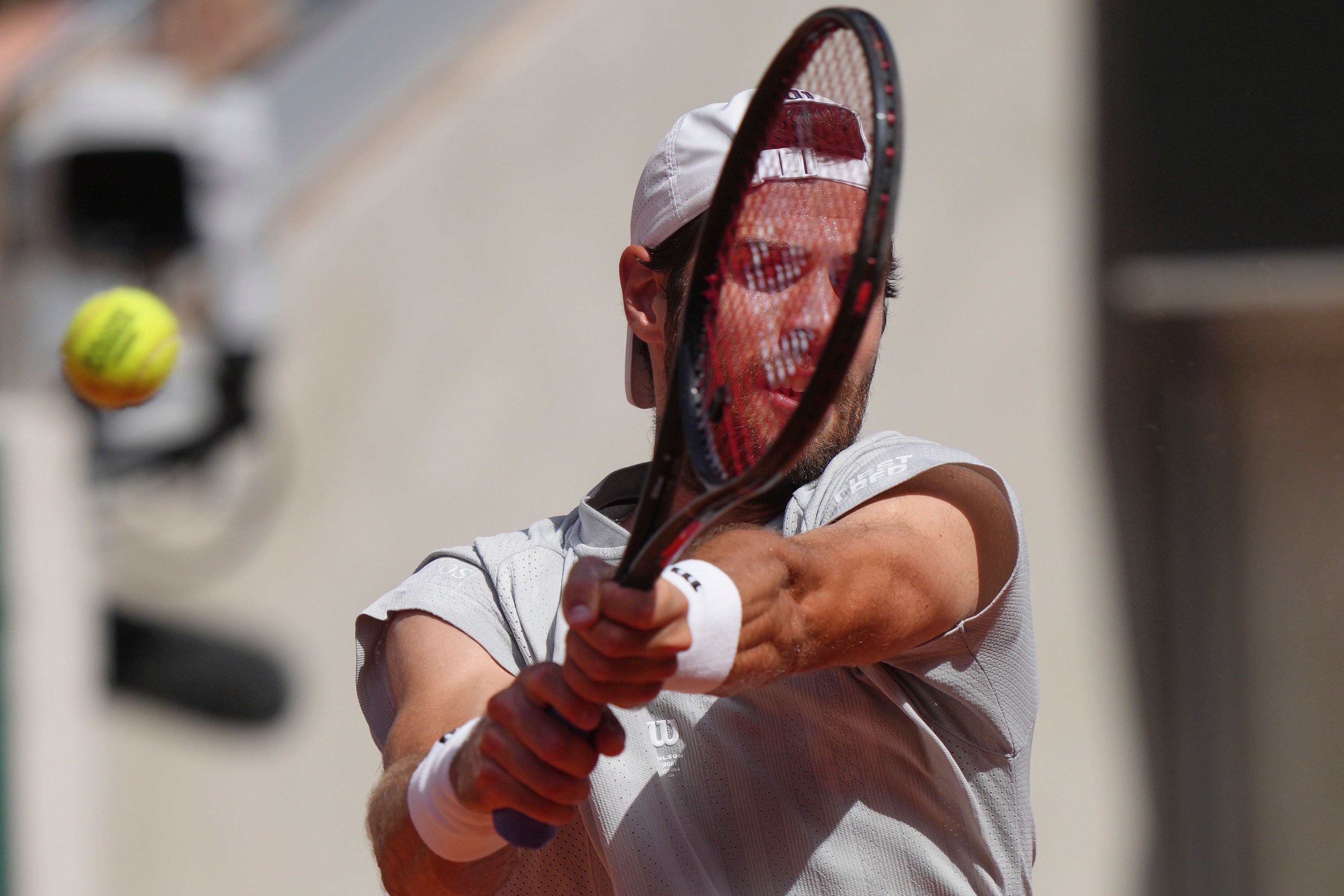 Karen Khachanov of Russia returns to Arthur Gea of France during the first round men's singles tennis match at the French Open tennis tournament in Paris, Sunday, May 24, 2026