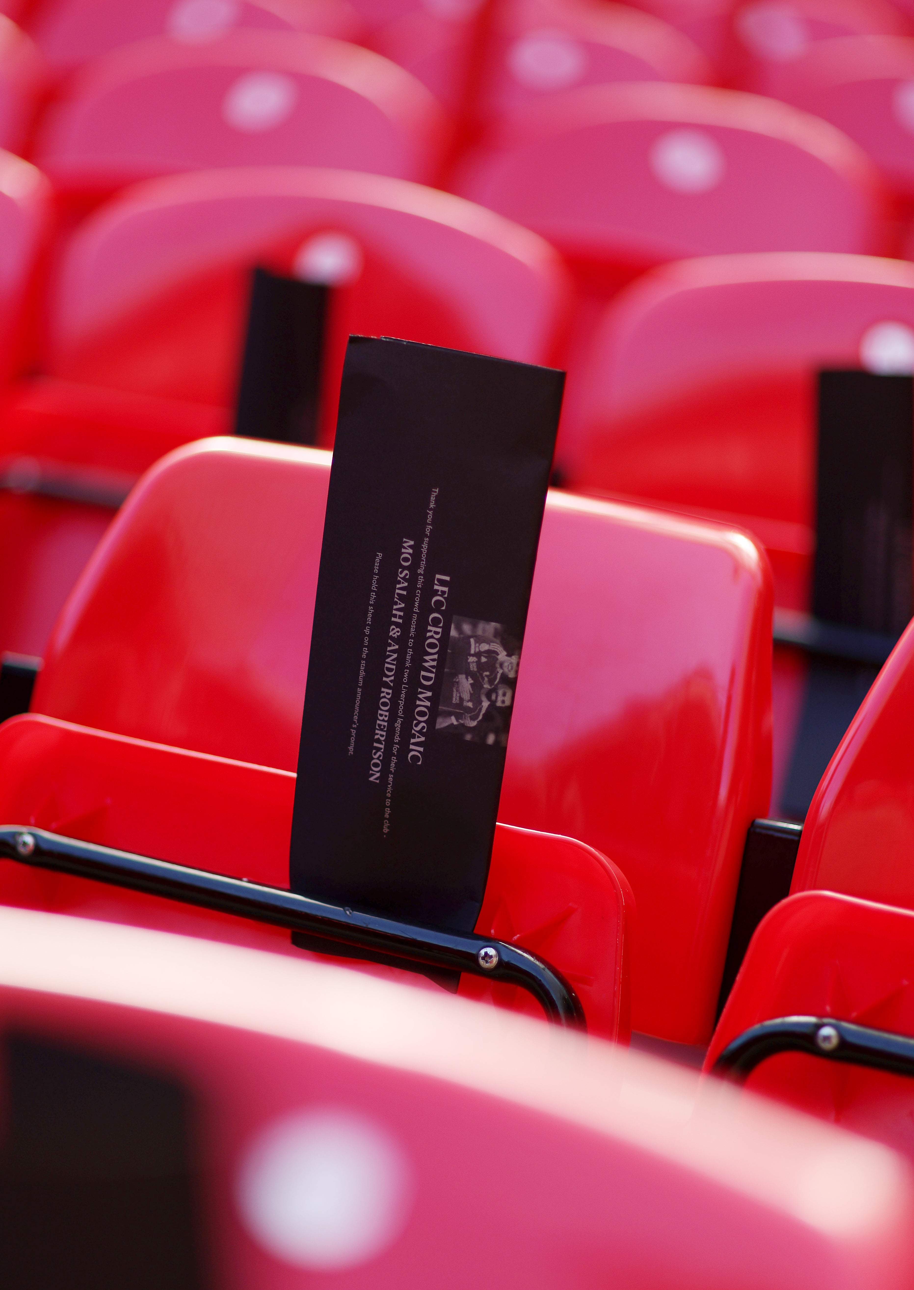 A detailed view of paper placed on seats inside the stadium that will create a crowd mosaic honouring Andrew Robertson and Mohamed Salah (Getty)