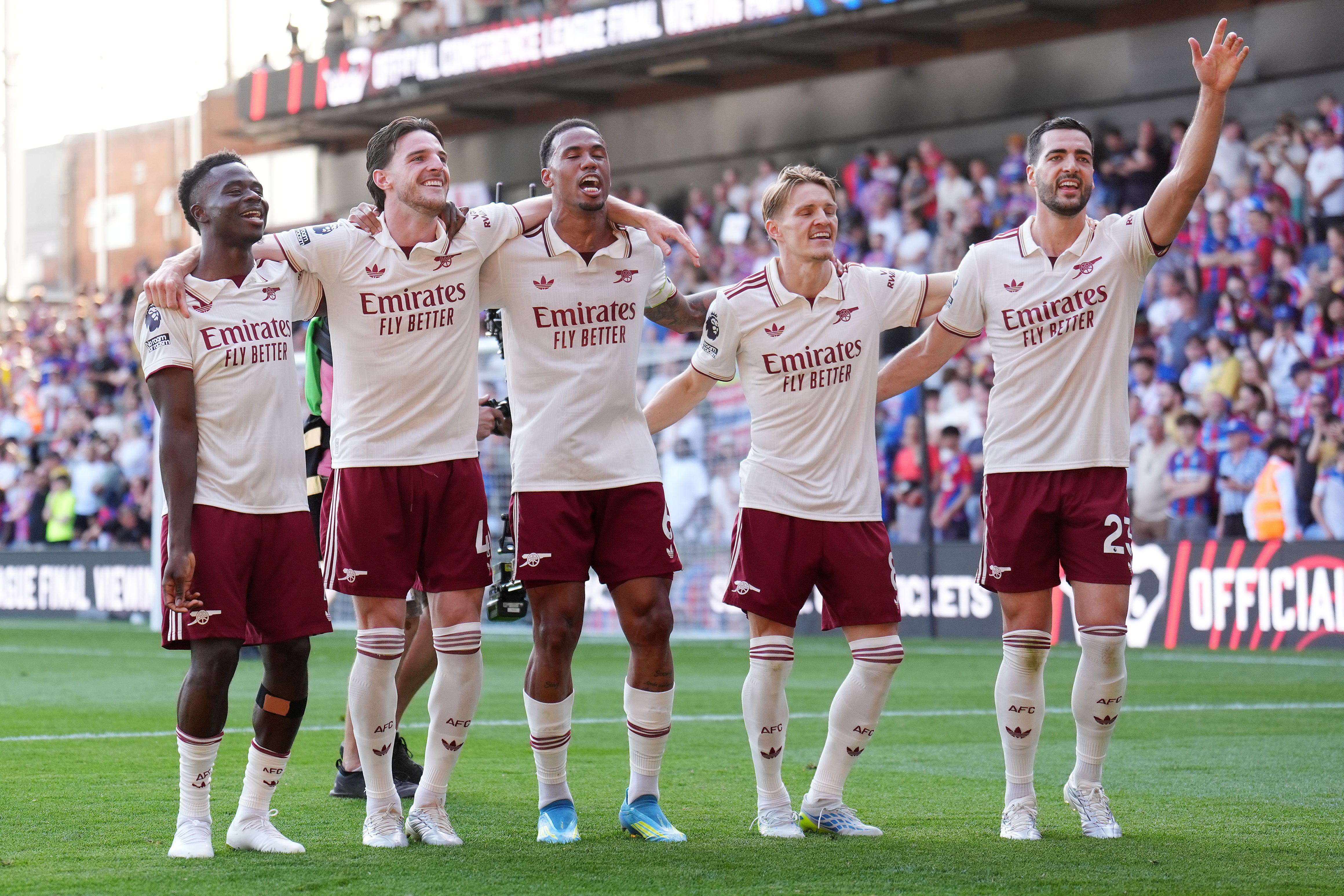 Arsenal players celebrate after their 26th league win of the season