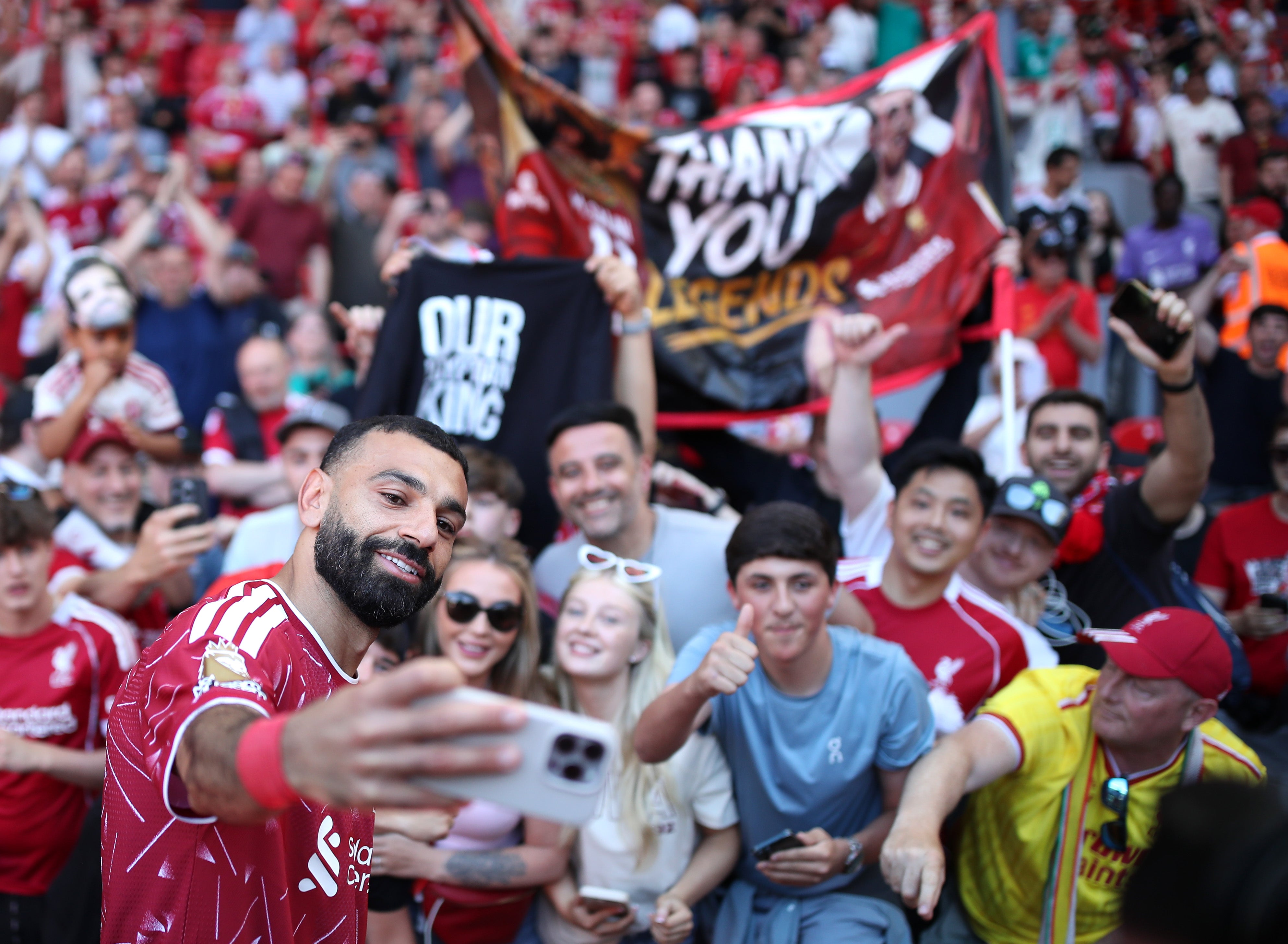 Mohamed Salah of Liverpool poses for a selfie with fans (Getty)