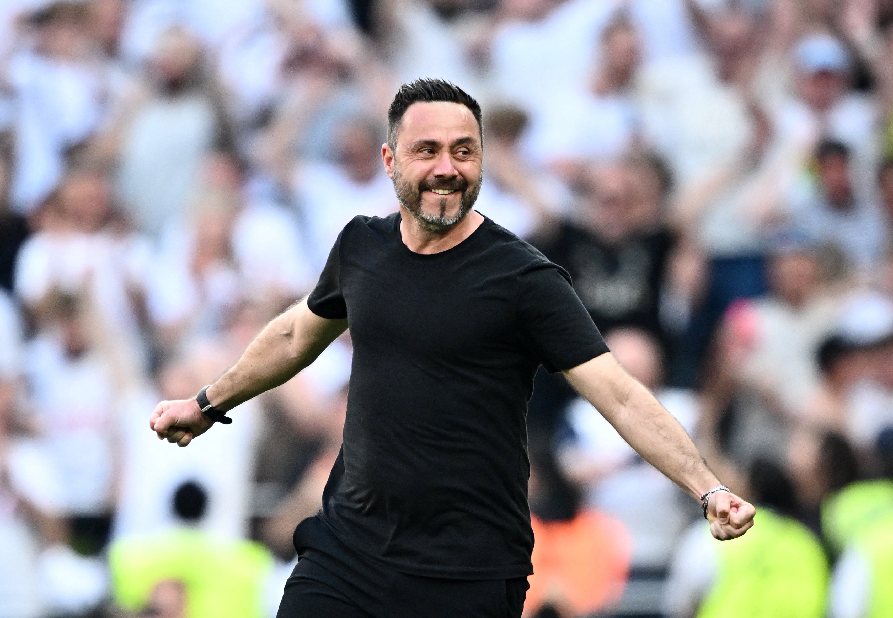 Roberto De Zerbi celebrates Tottenham's survival