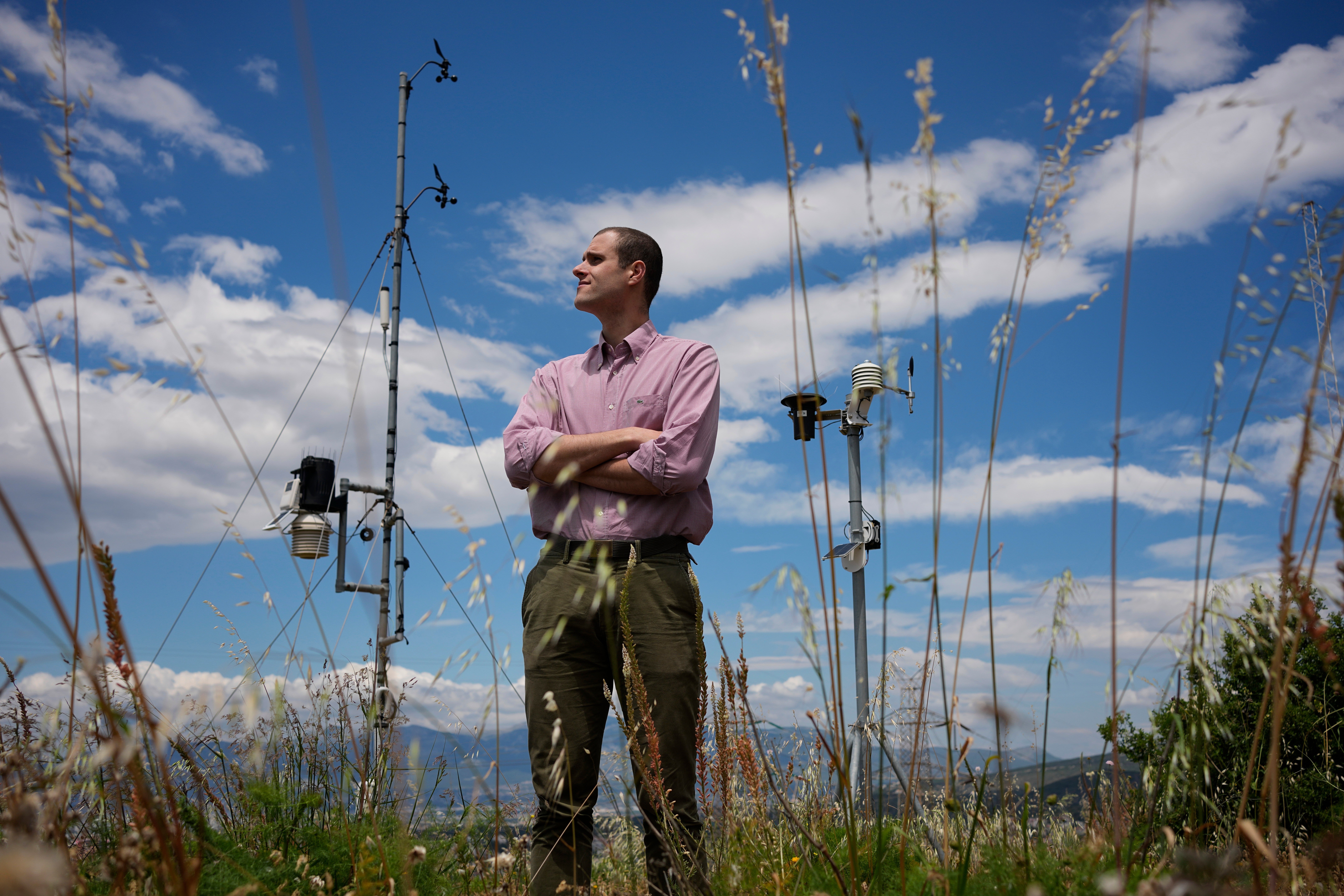 Snow hydrologist Konstantis Alexopoulos stands on Mount Penteli, in Athens