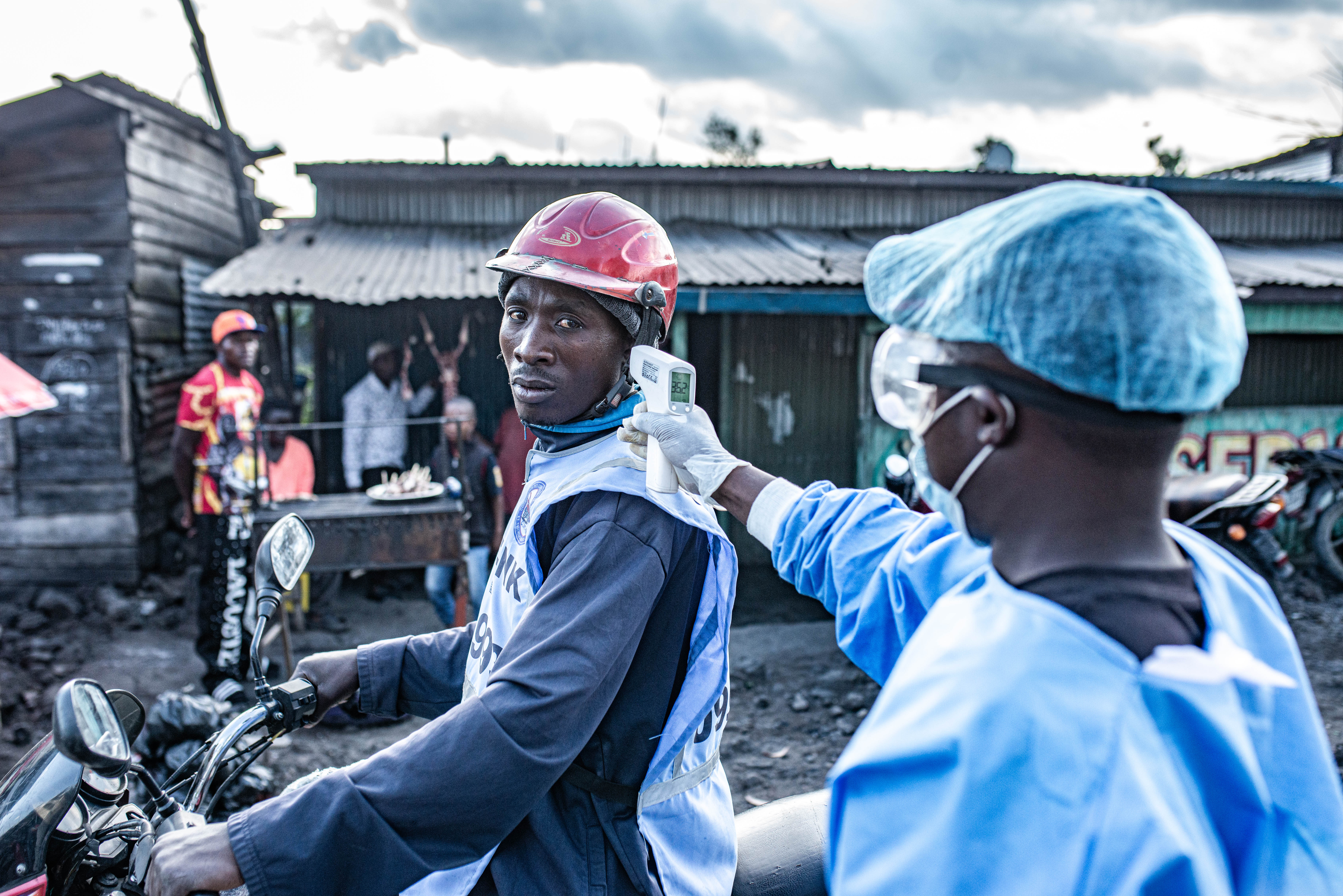 Health officials screen travellers for Ebola at the Kanyaruchinya checkpoint in Congo (Getty)