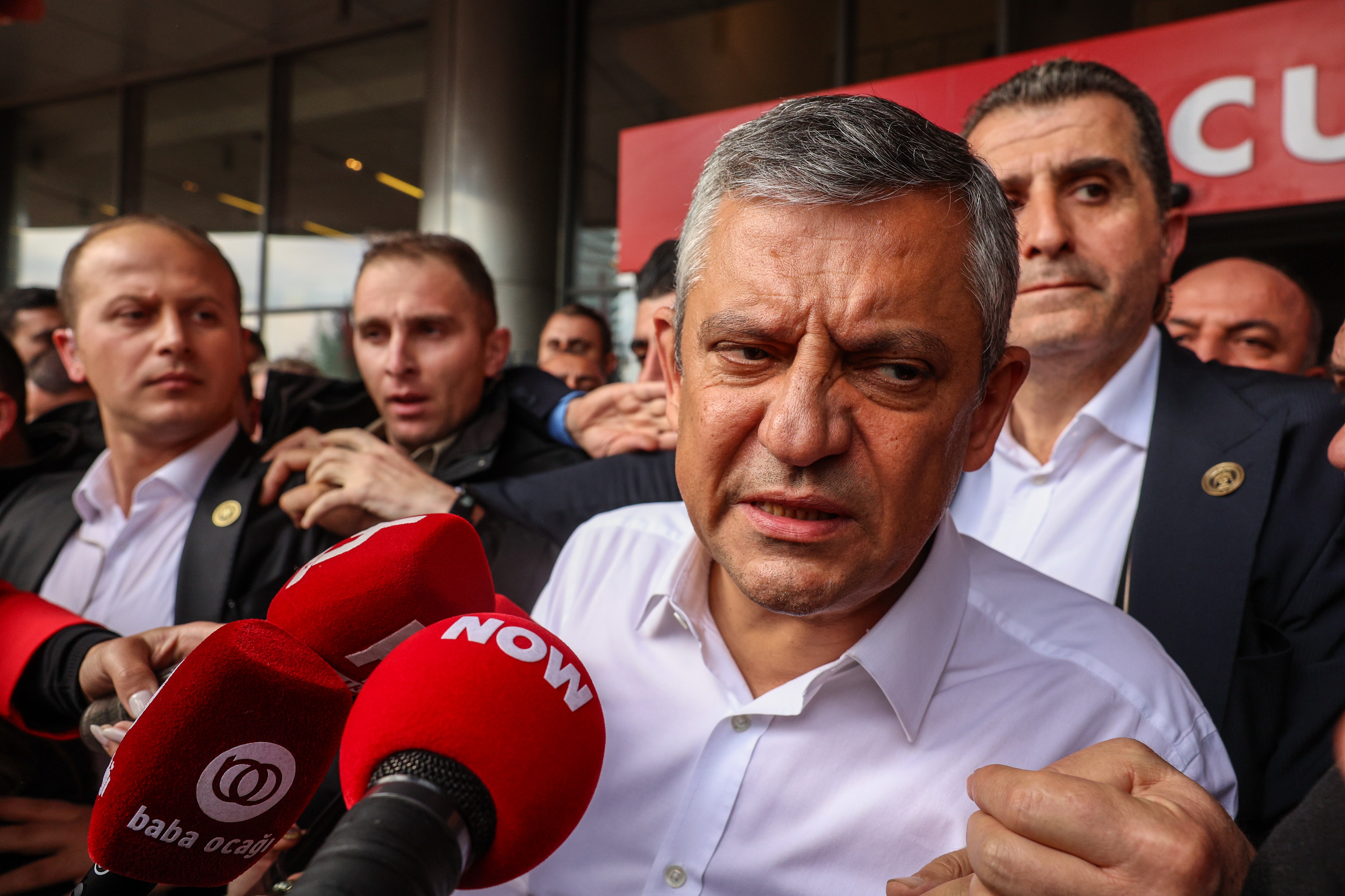 Ousted CHP leader Ozgur Ozel walks out from the party’s headquarters after being evicted by police in Ankara on 24 May 2026 (Getty)
