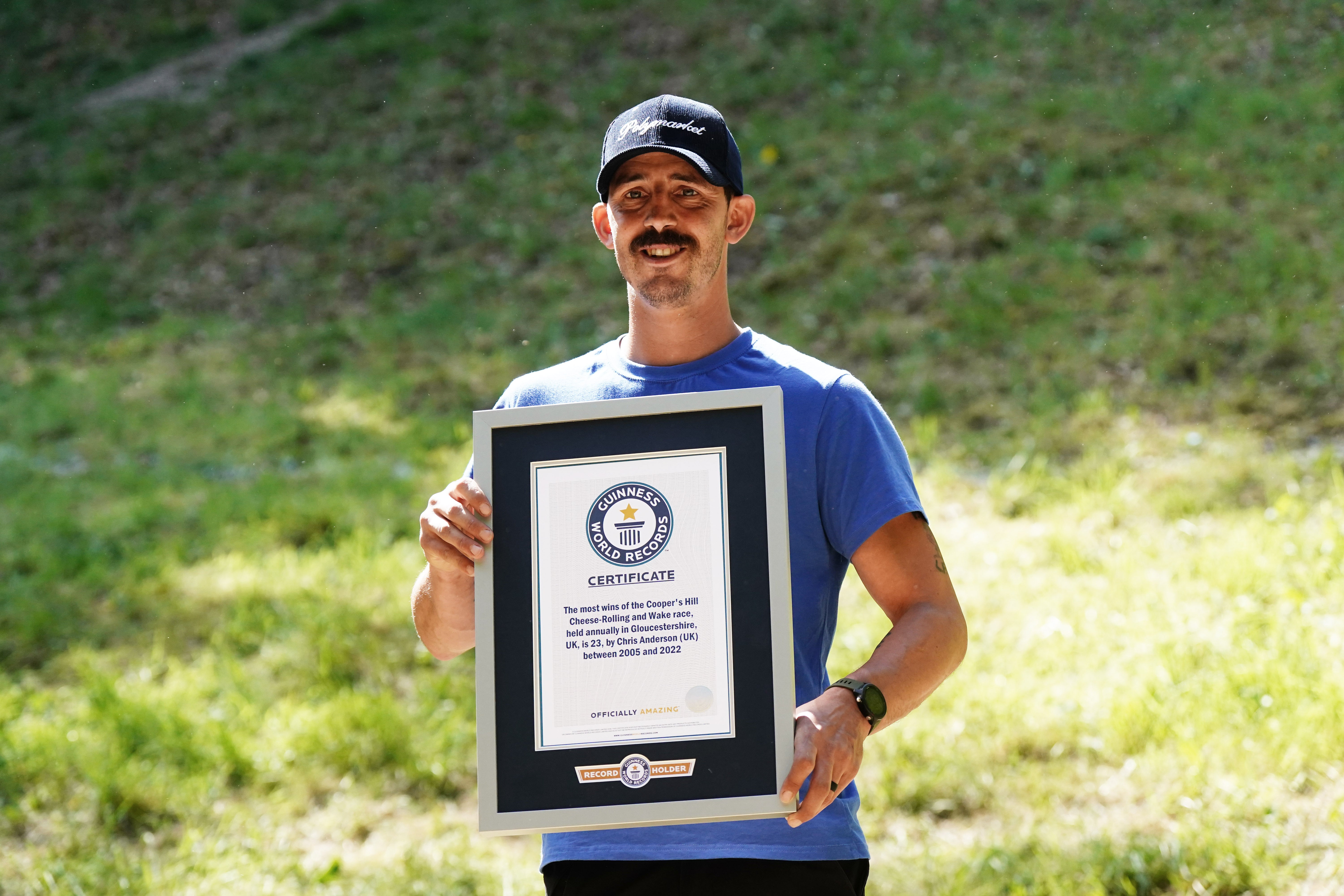 Chris Anderson with a Guinness World Records certificate for most wins. (Jacob King/PA)