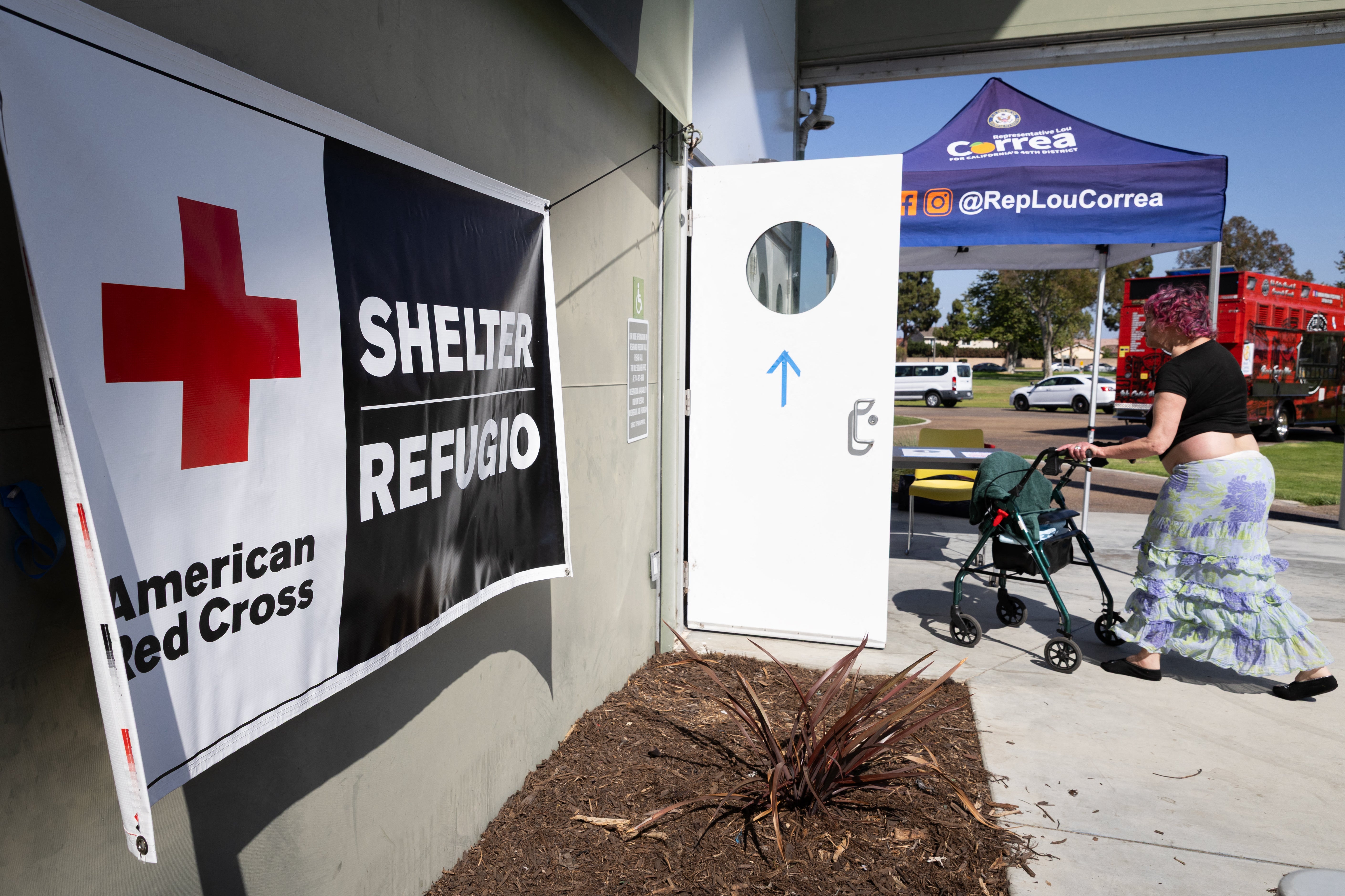 A woman enters an evacuation shelter in Fountain Valley, California.