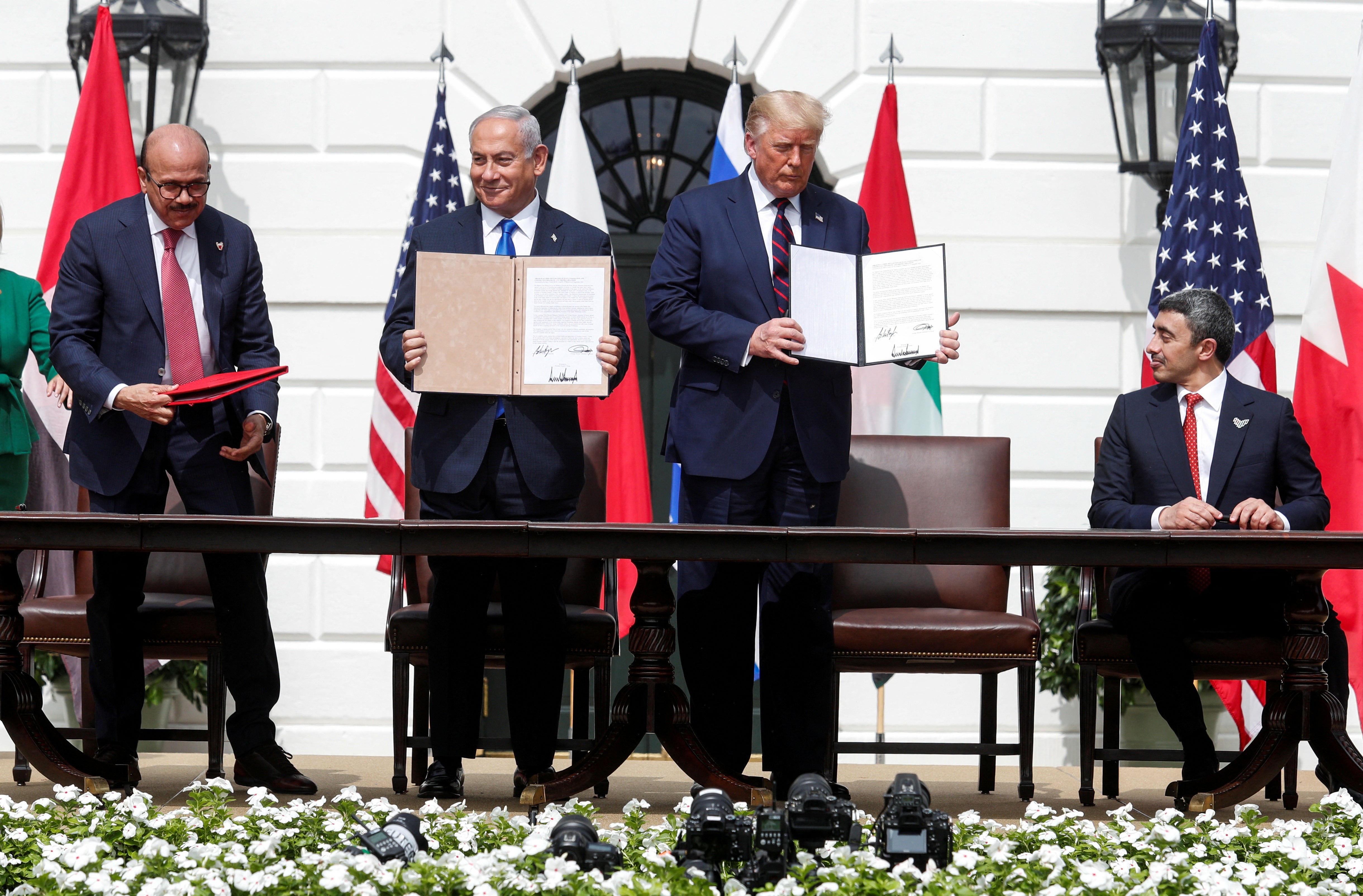 Bahrain's Foreign Minister Abdullatif Al Zayani, Netanyahu, Trump and United Arab Emirates (UAE) Foreign Minister Abdullah bin Zayed participate in the signing of the Abraham Accords in 2020