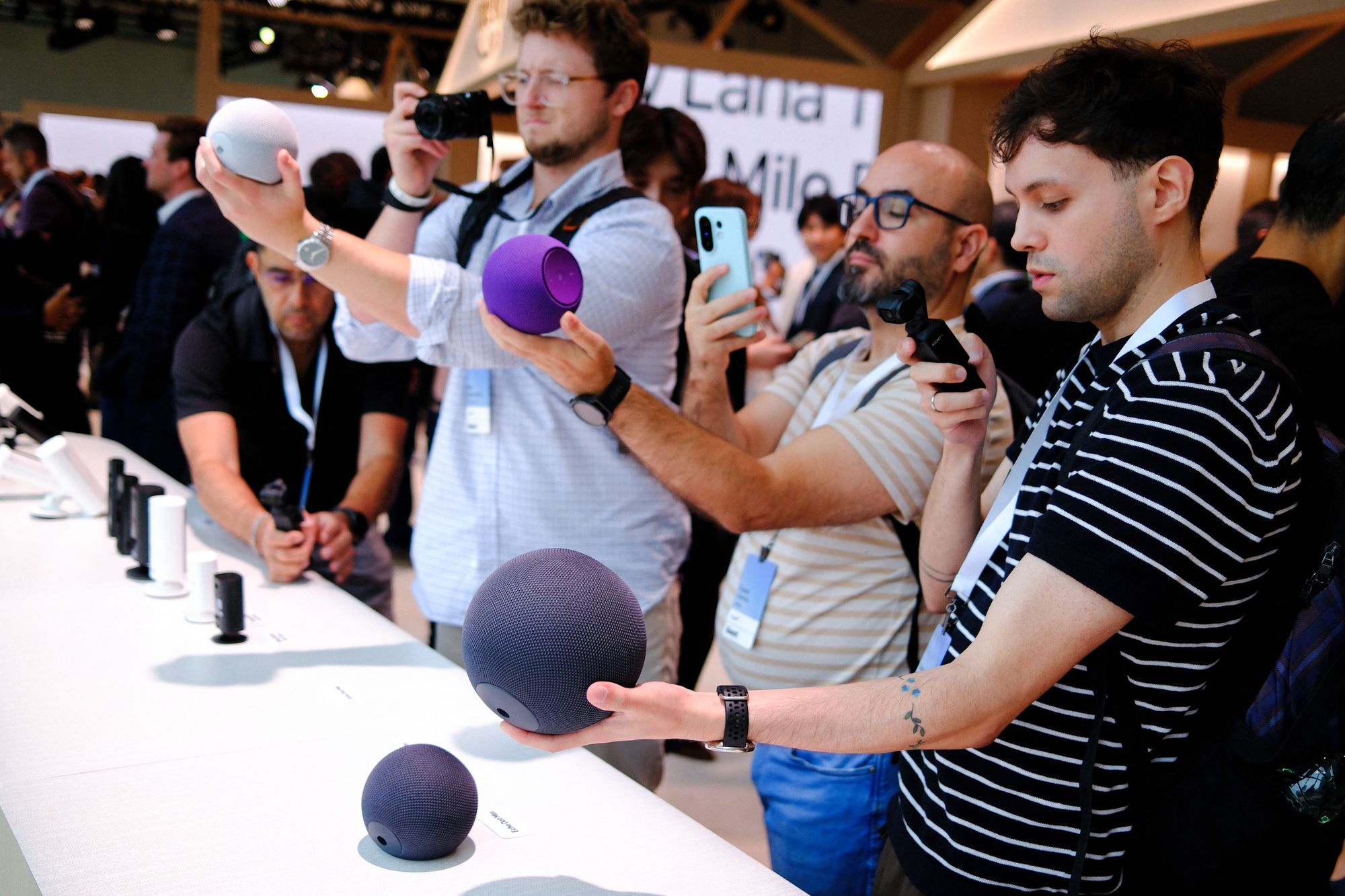 People take pictures of smart speakers