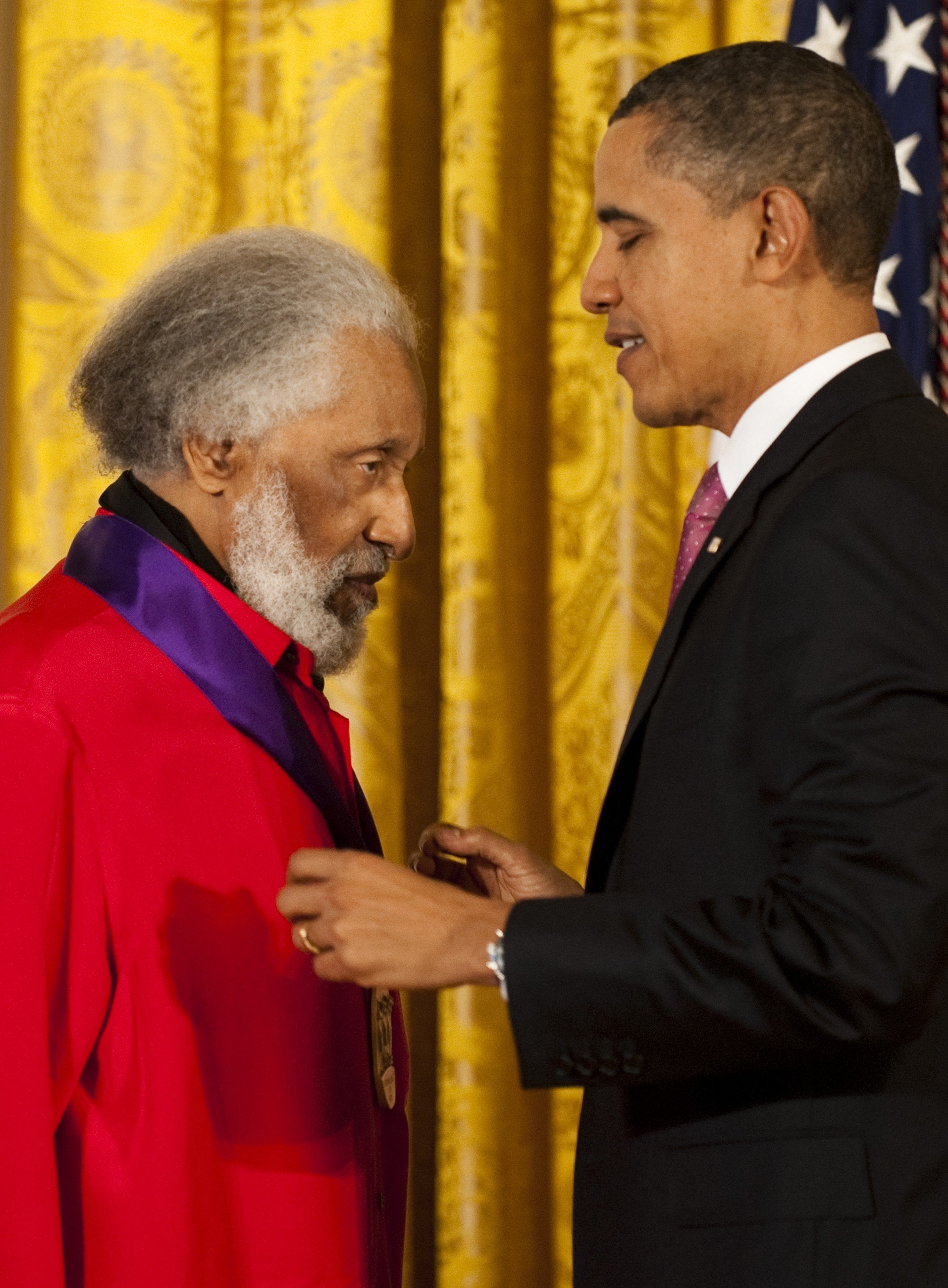 Former US president Barack Obama awards the 2010 National Medal of Arts to Grammy-winning American jazz tenor Sonny Rollins at the White House in Washington, DC, in 2011
