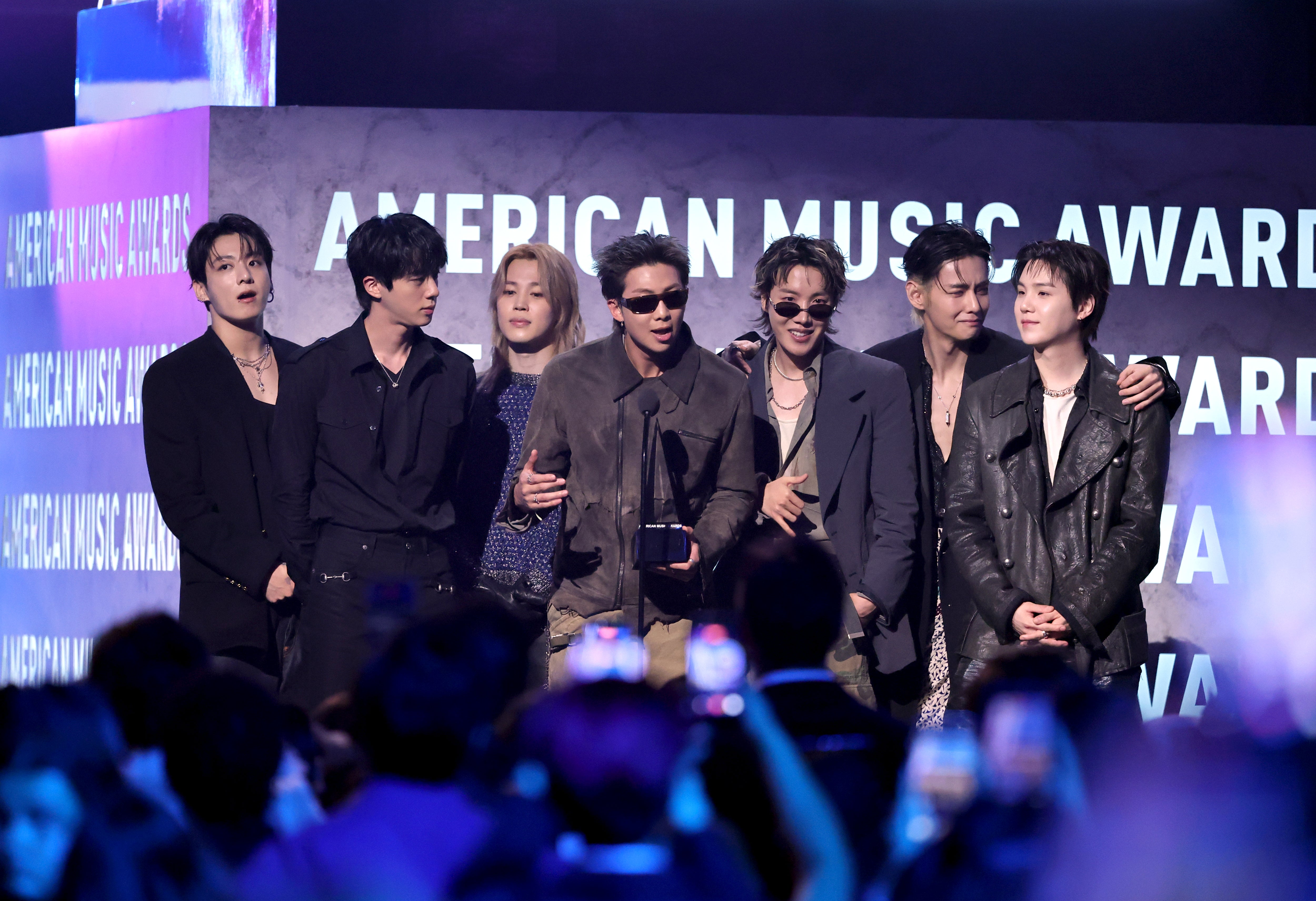 Jungkook, Jin, Jimin, RM, J-Hope, V and Suga of BTS accept the Artist of the Year award onstage during the 52nd American Music Awards