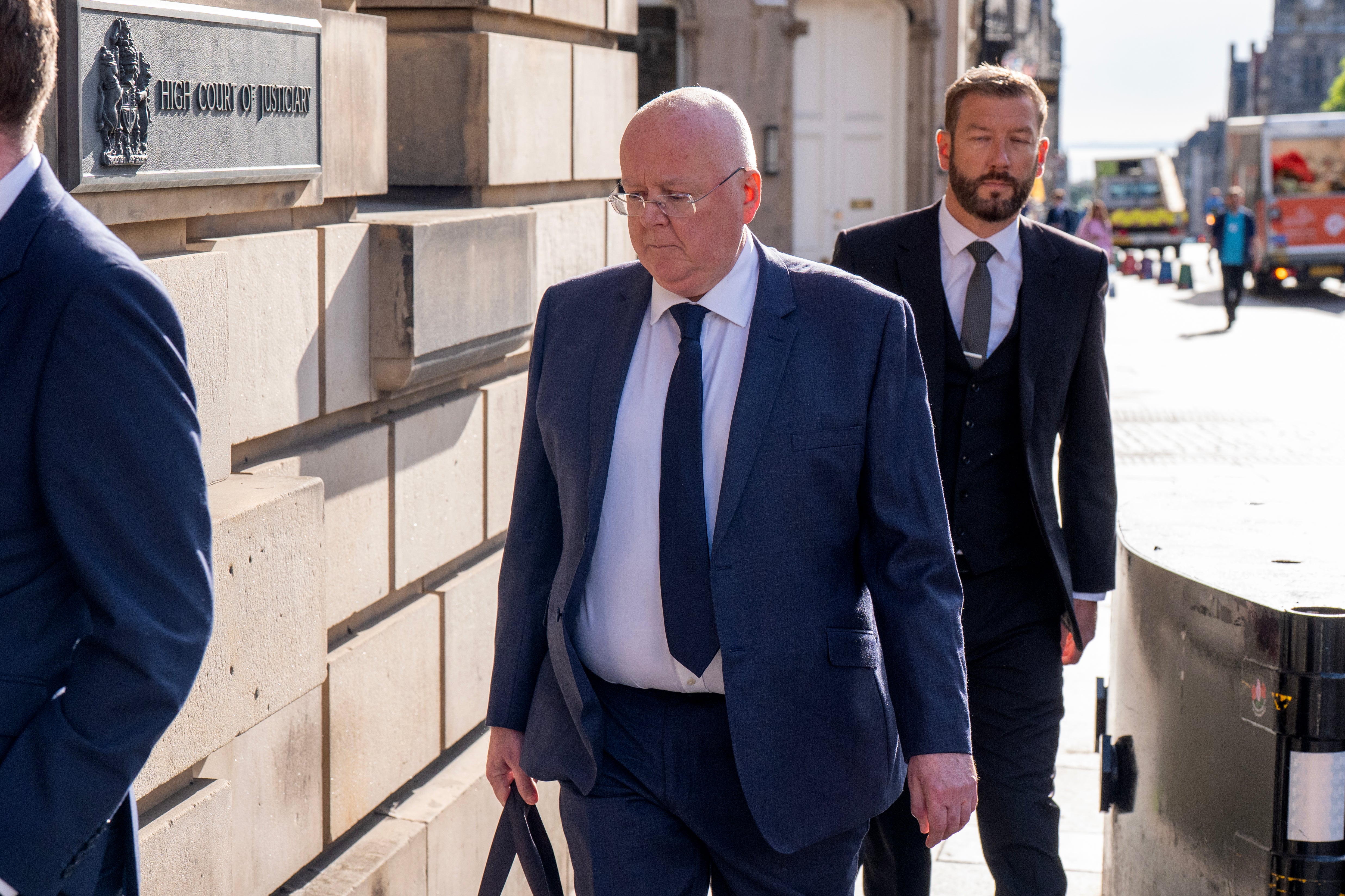 Former SNP chief executive Peter Murrell, centre, arrives at Edinburgh High Court where he pleaded guilty to embezzling funds