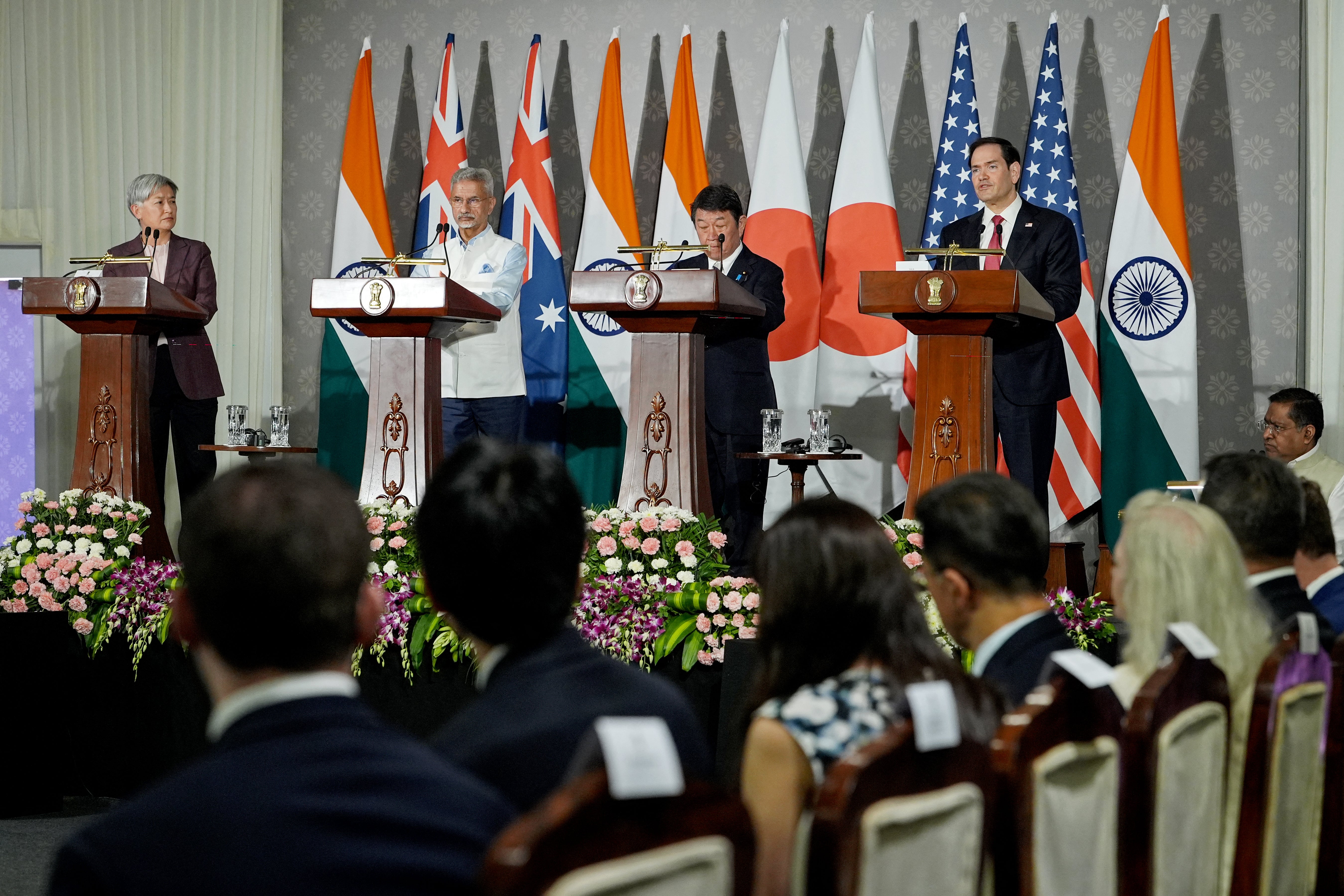 Foreign ministers Penny Wong of Australia, S Jaishankar of India, Toshimitsu Motegi of Japan, and Marco Rubio of the US address a press conference after their meeting in Delhi on 26 May 2026 (AFP/Getty)
