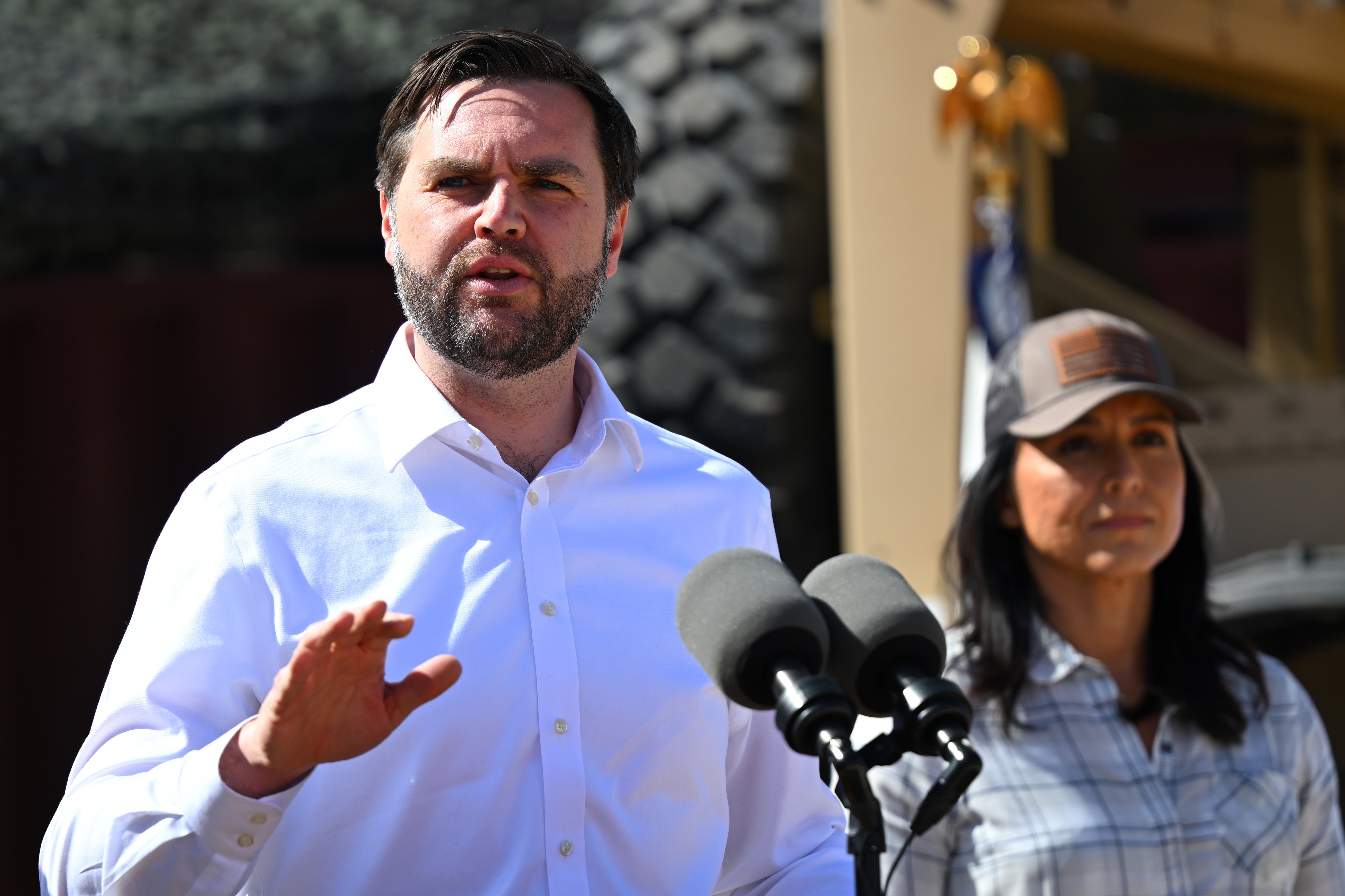 Vice President JD Vance speaks as Director of National Intelligence Tulsi Gabbard looks on during a visit to the U.S.-Mexico border in March 2025 in Eagle Pass, Texas.