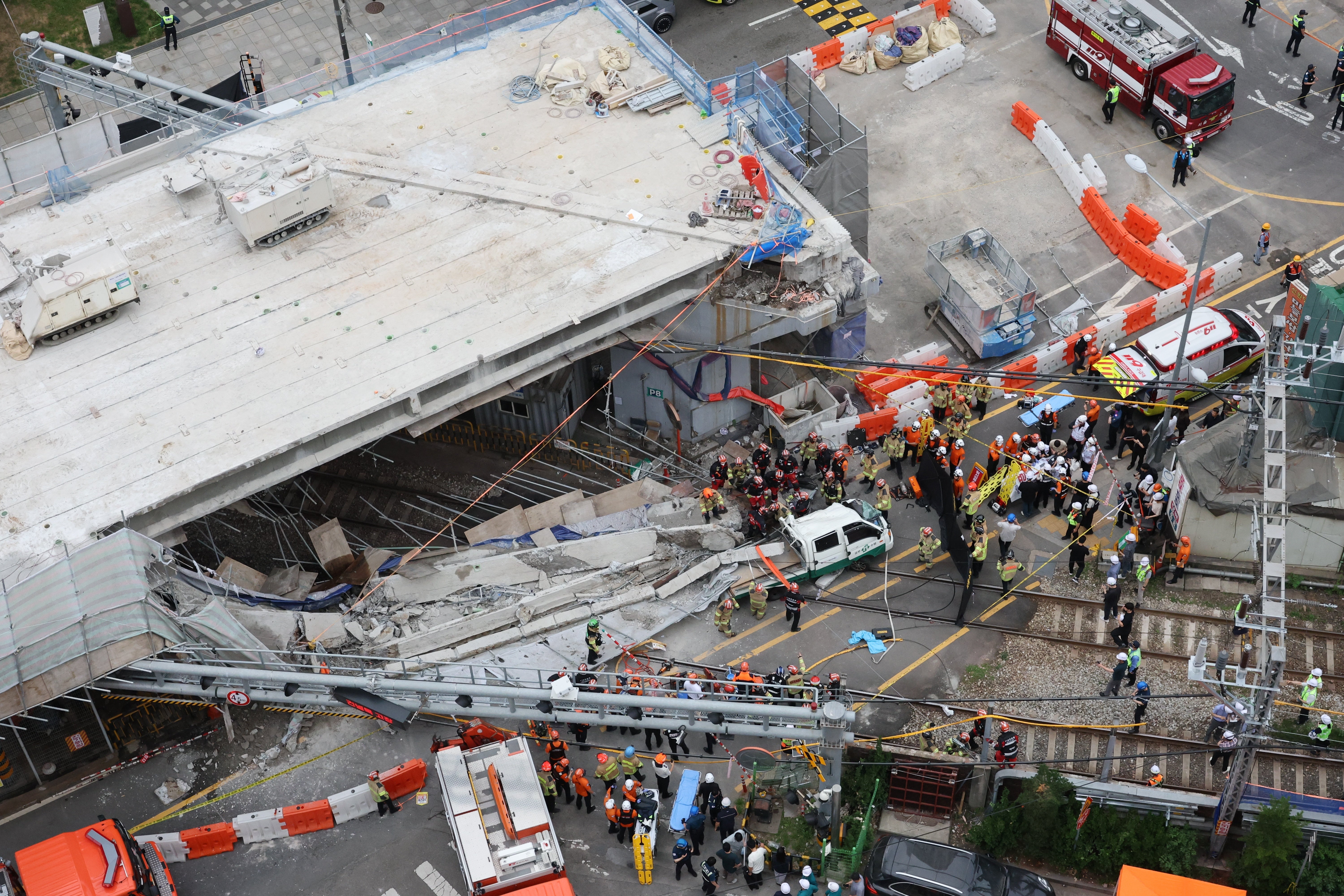 Rescue workers working on the site in Seoul