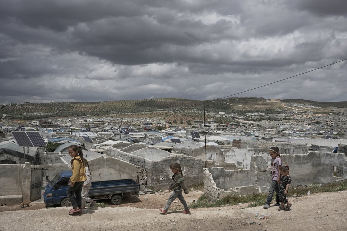 Cash-strapped Syrians living in tent settlements struggle to return home after Assad's fall