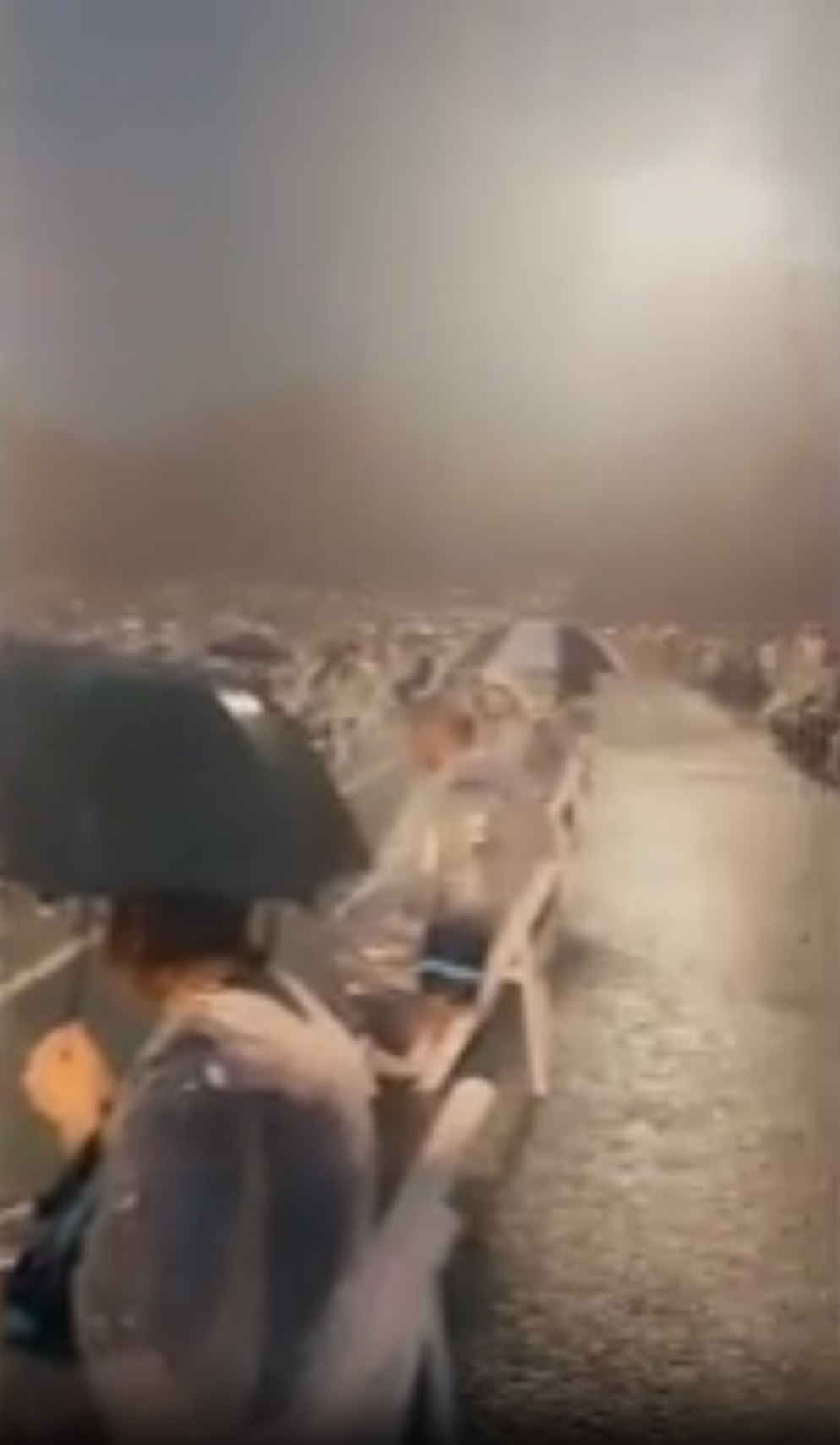 Two high school graduations in Tennessee went viral this weekend after videos showed students getting drenched in rain in their caps and gowns