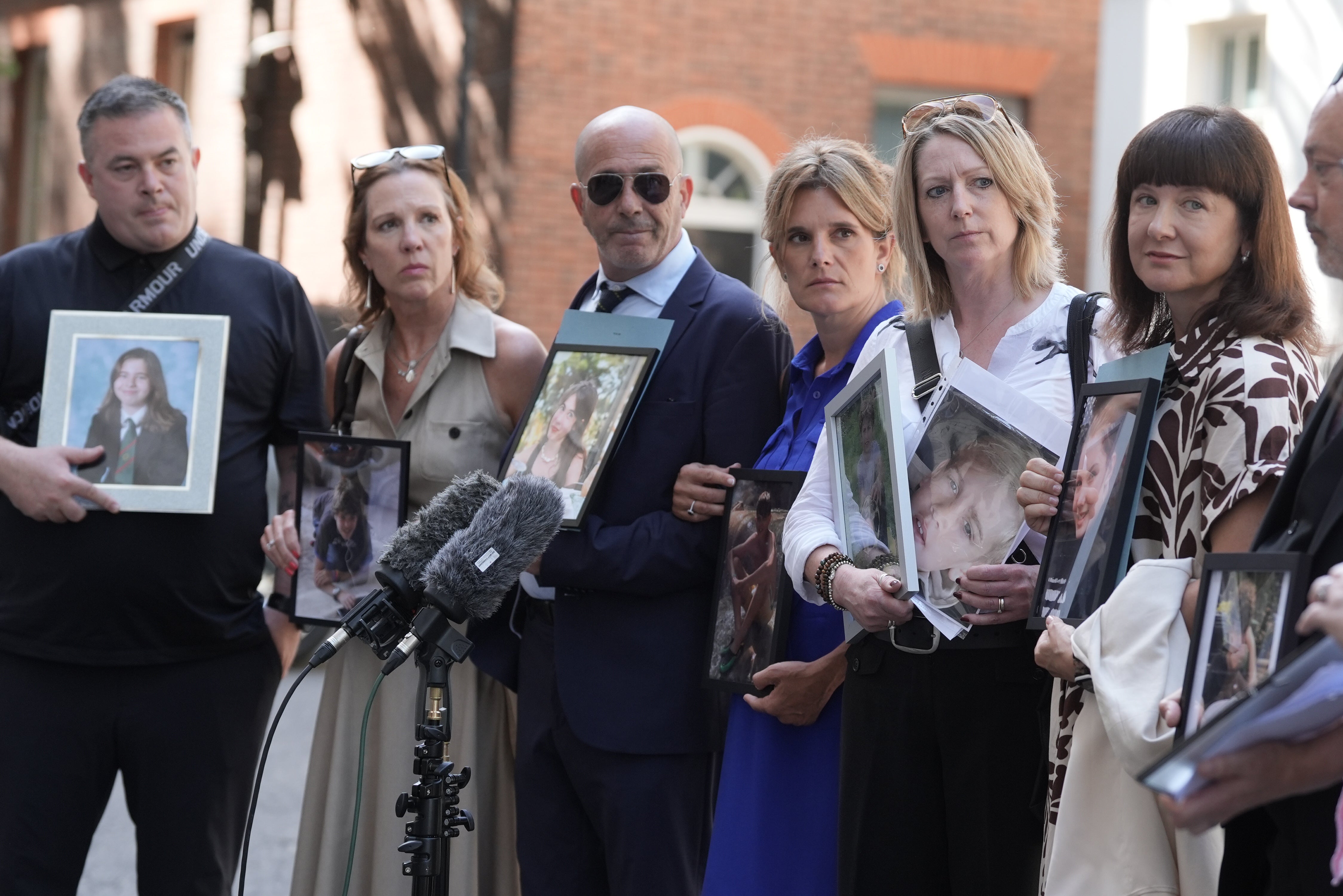 Speaking outside of No 10 after the meeting, the parents, many of whom carried a picture of their child, demanded an immediate review of regulator Ofcom (PA)