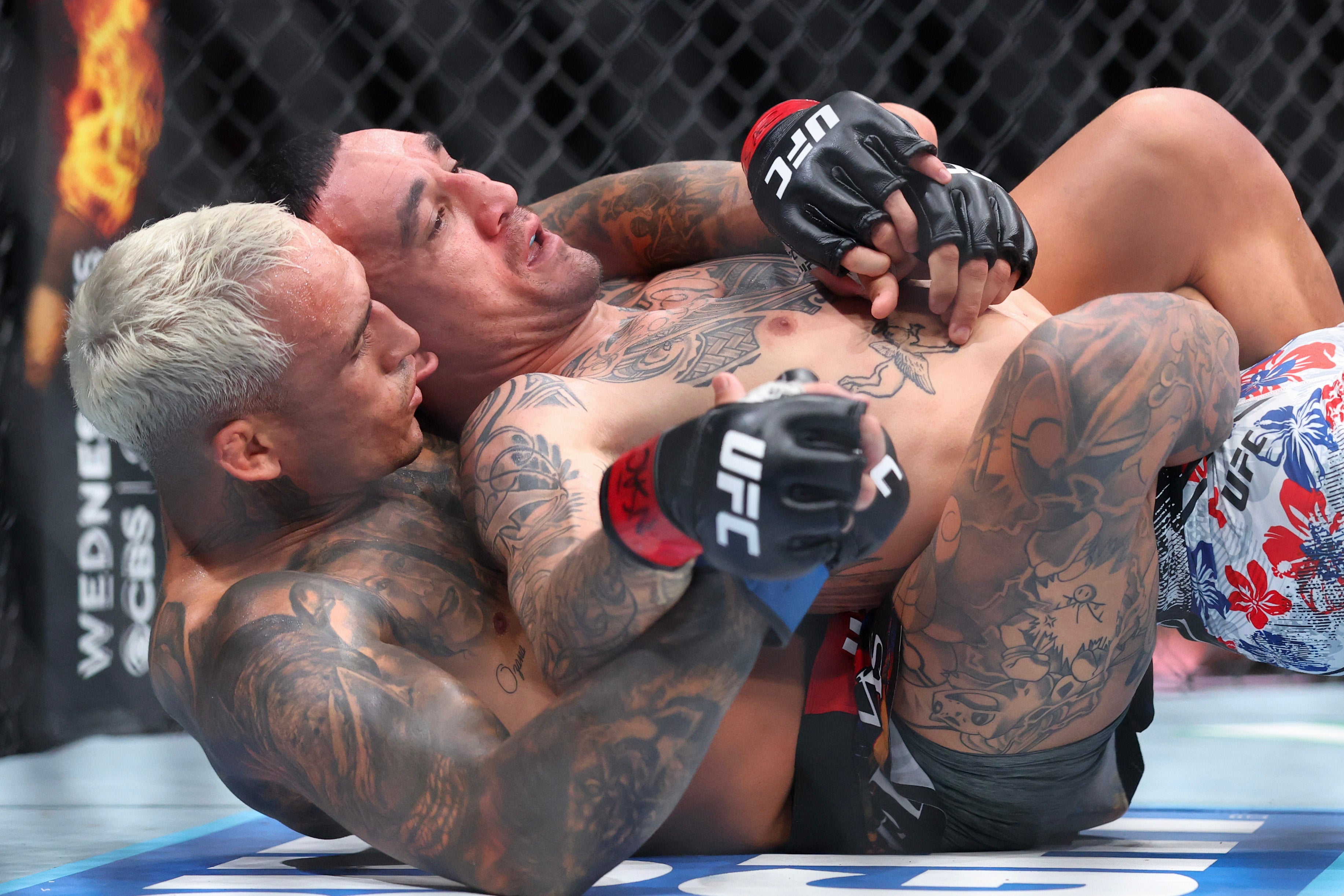 Max Holloway (right) was out-grappled and outpointed by Charles Oliveira in March