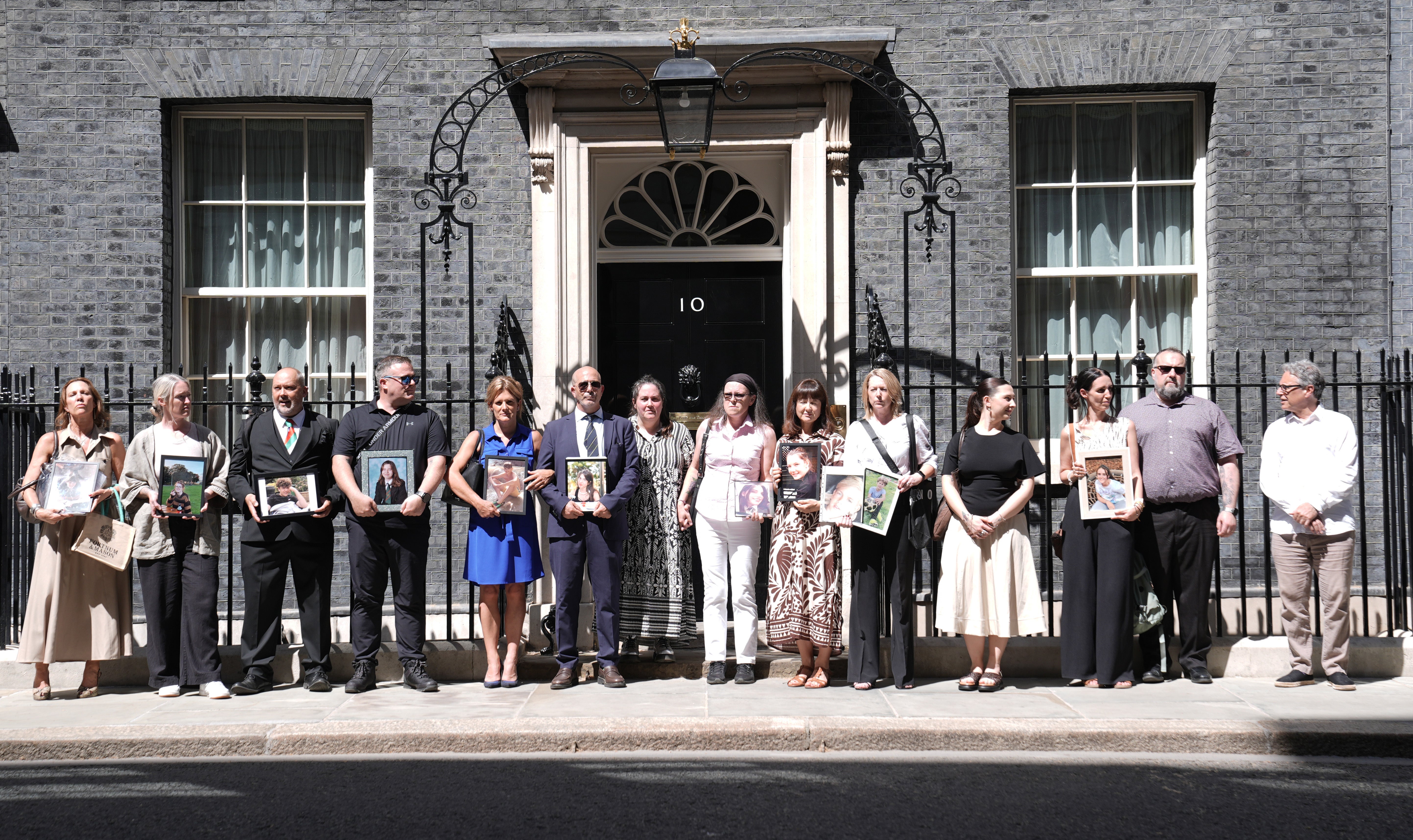 Families who have lost children to suicide gather in Downing Street (Stefan Rousseau/PA)