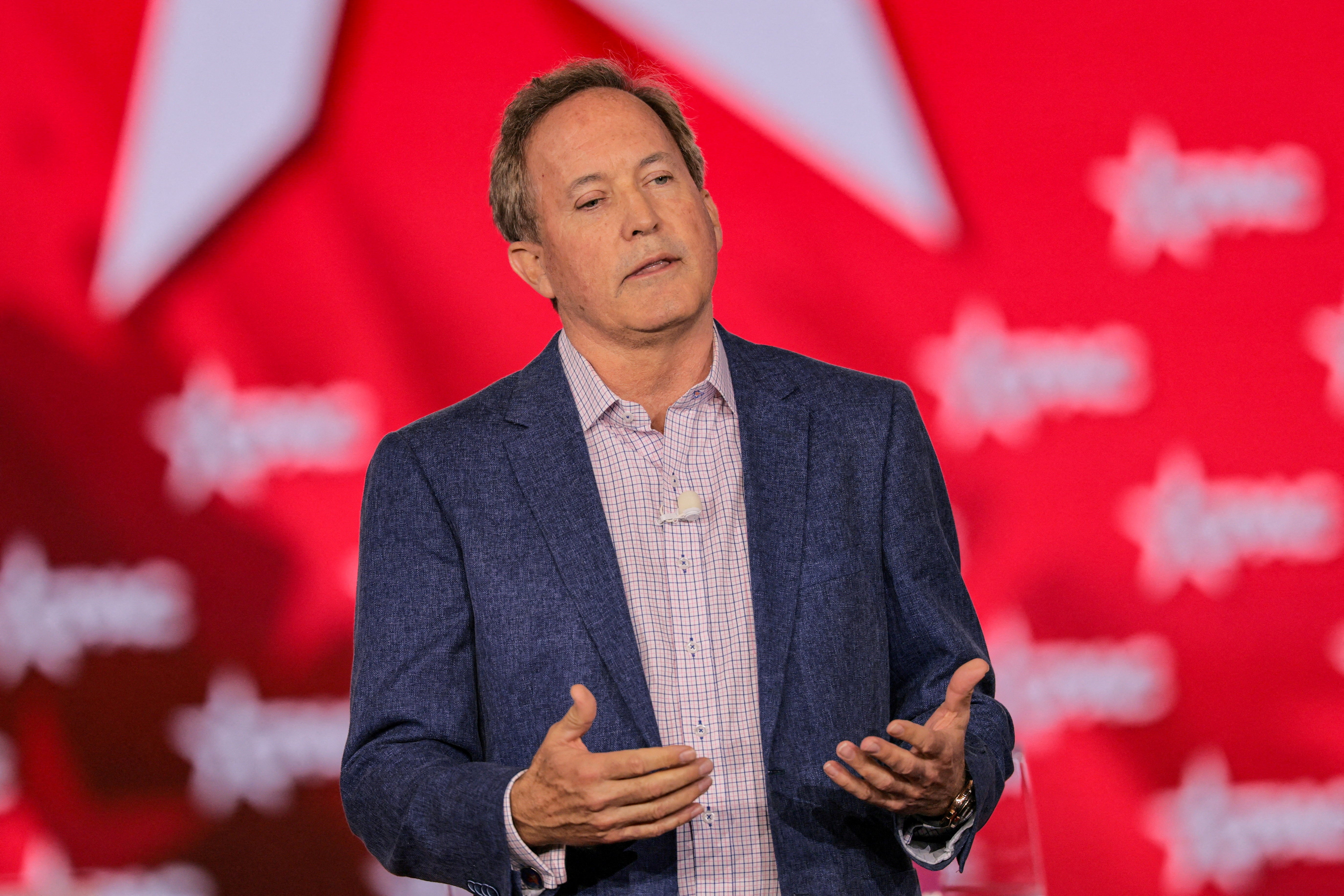 Texas Attorney General Ken Paxton, seen during the Conservative Political Action Conference in Grapevine, Texas on March 28, does not appear to have the support of his wife, who is divorcing him ‘on biblical grounds’