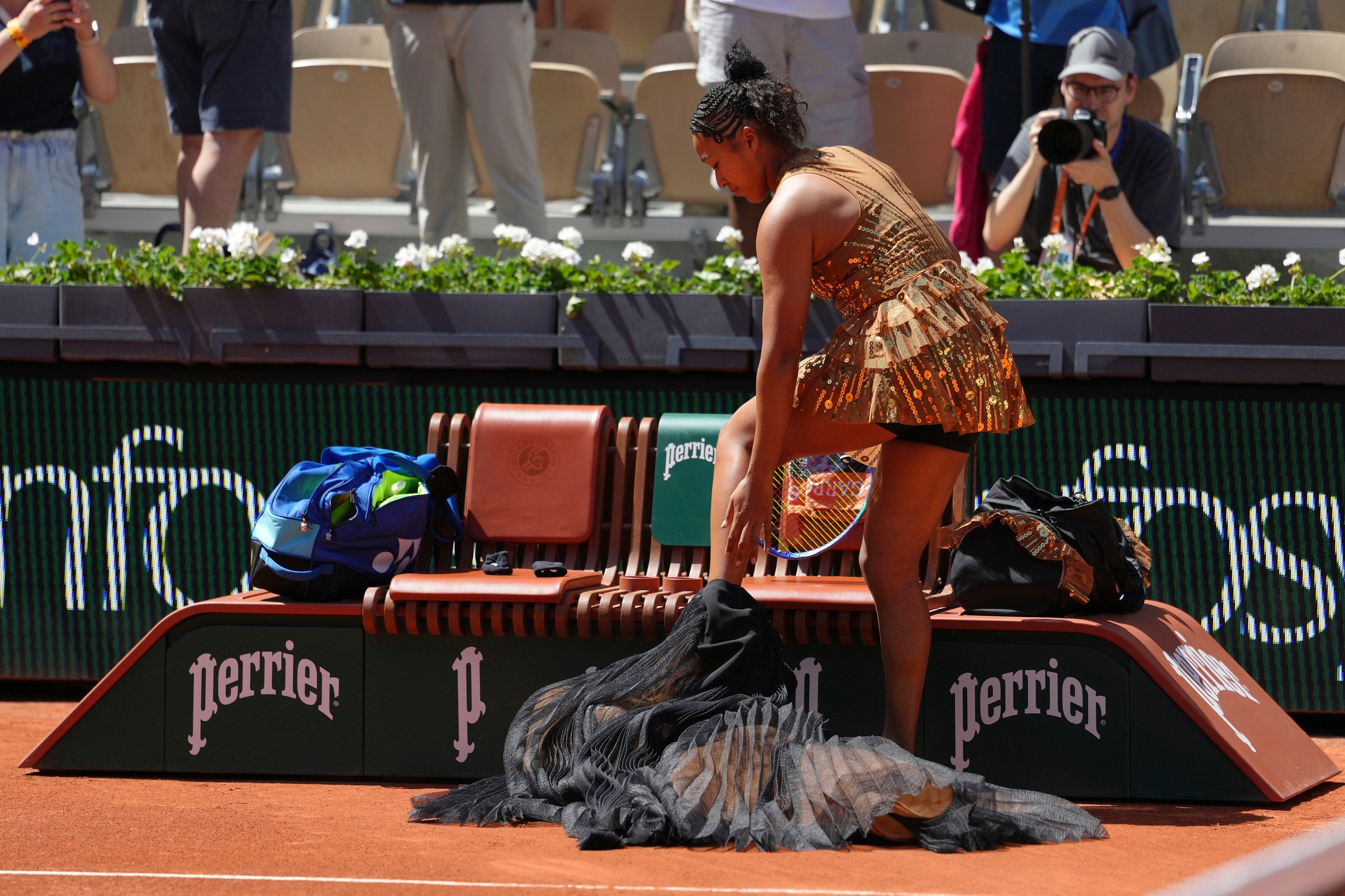 Naomi Osaka had to remove her ceremonial black skirt and beaded bodice before the match, much to the chagrin of Laura Siegemund