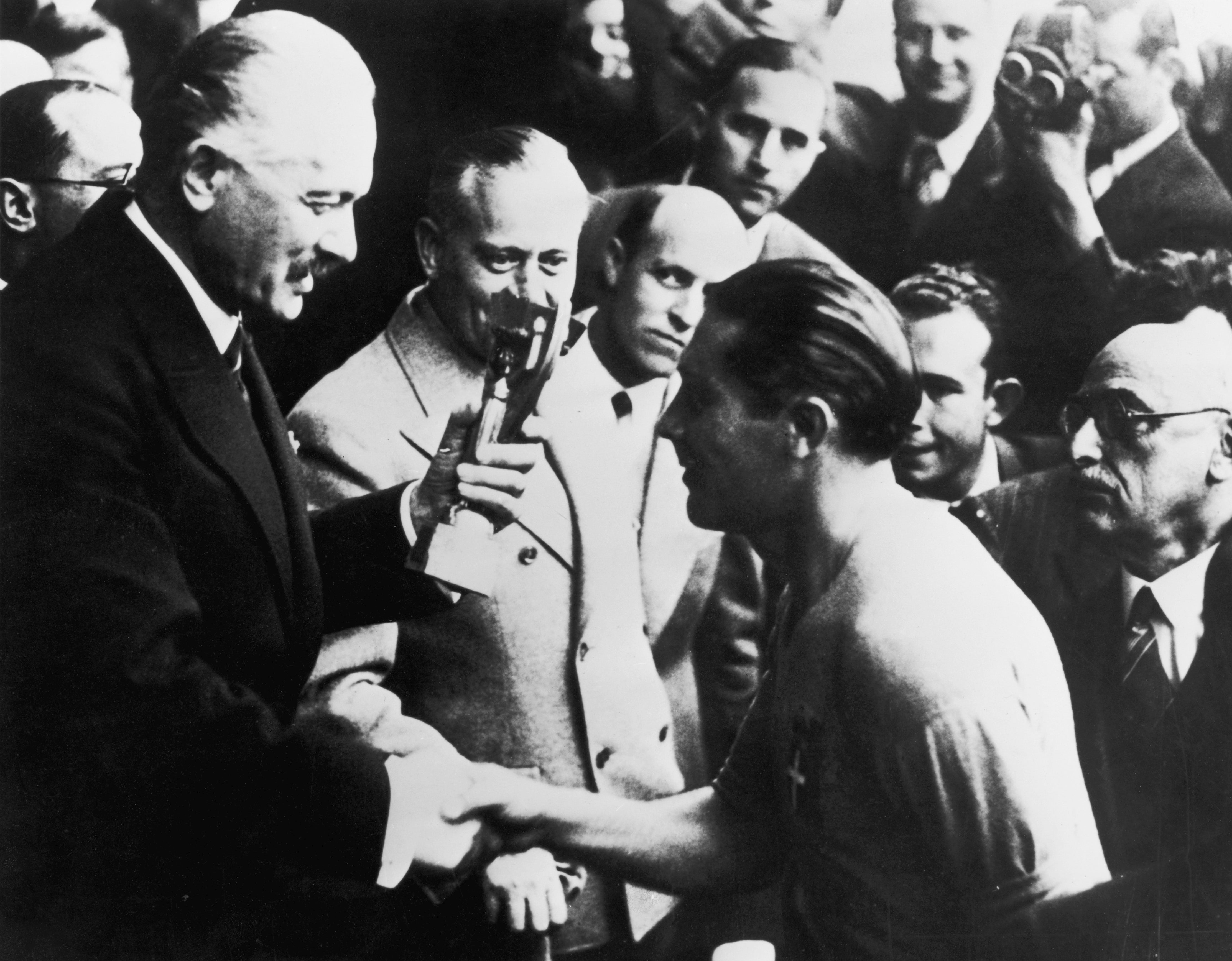 Italy captain Giuseppe Meazza receives the Jules Rimet trophy after his team's 4-2 victory over Hungary in 1938