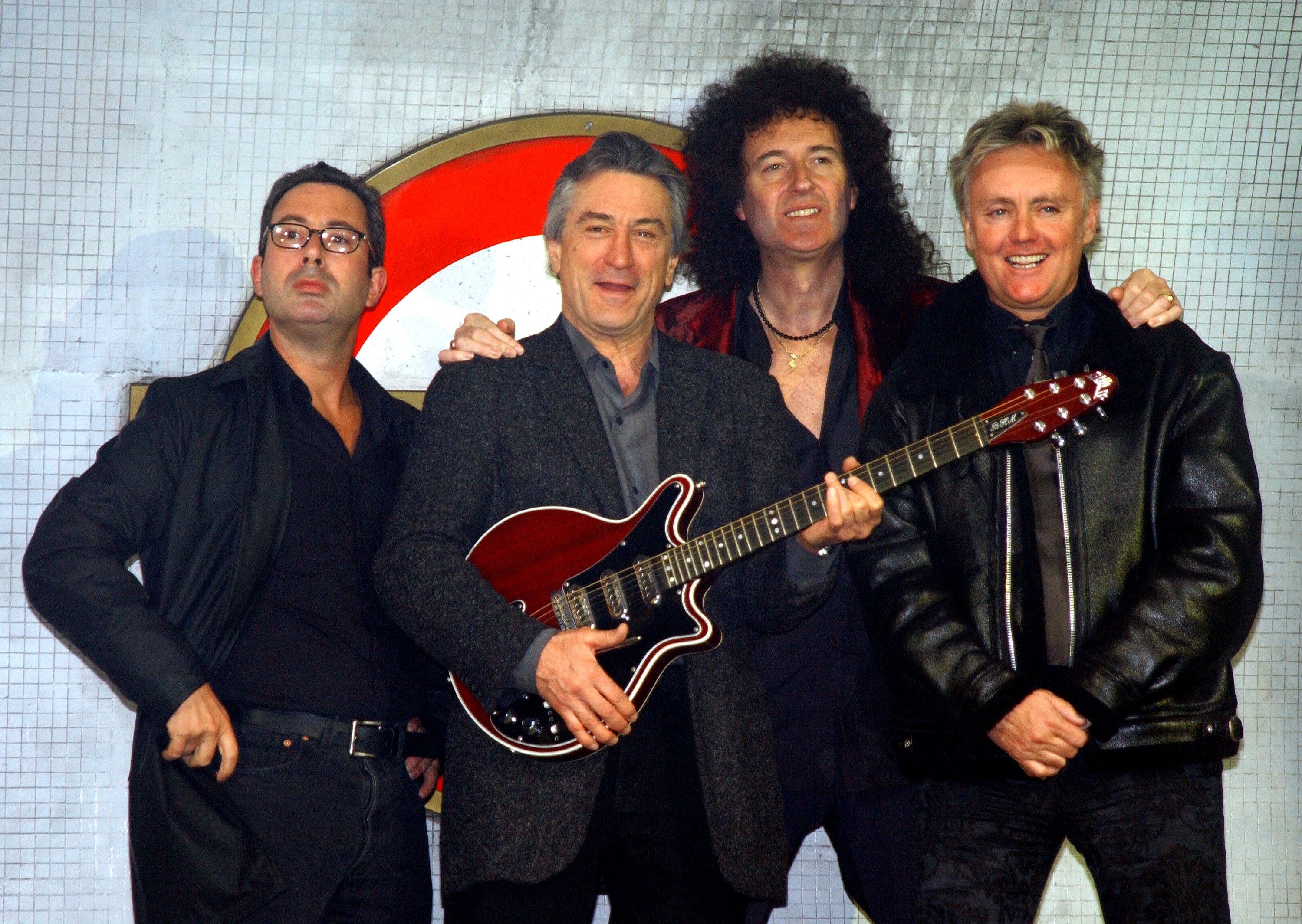 Elton at the launch of the musical 'We Will Rock You' in 2002, alongside Queen's Brian May and Roger Taylor, and producer Robert De Niro (Getty Images)