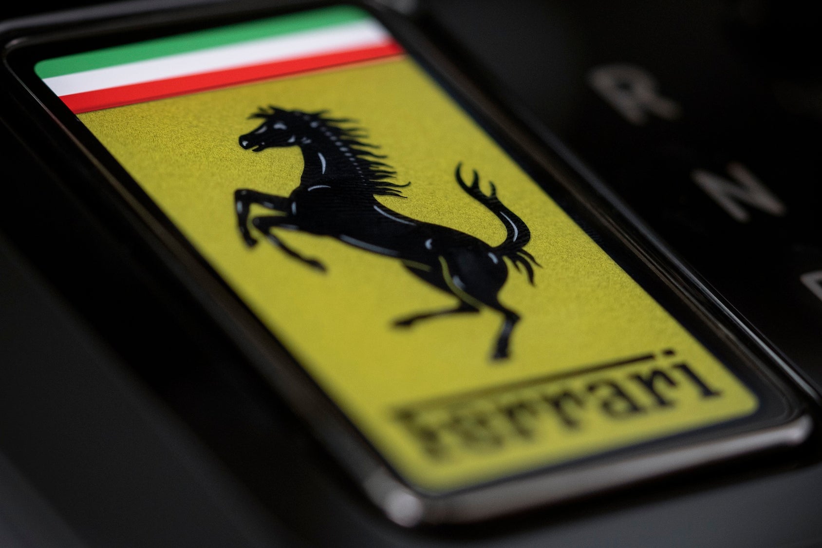 The Luce's key is a piece of toughened glass with an E Ink display that changes colour (Ferrari)