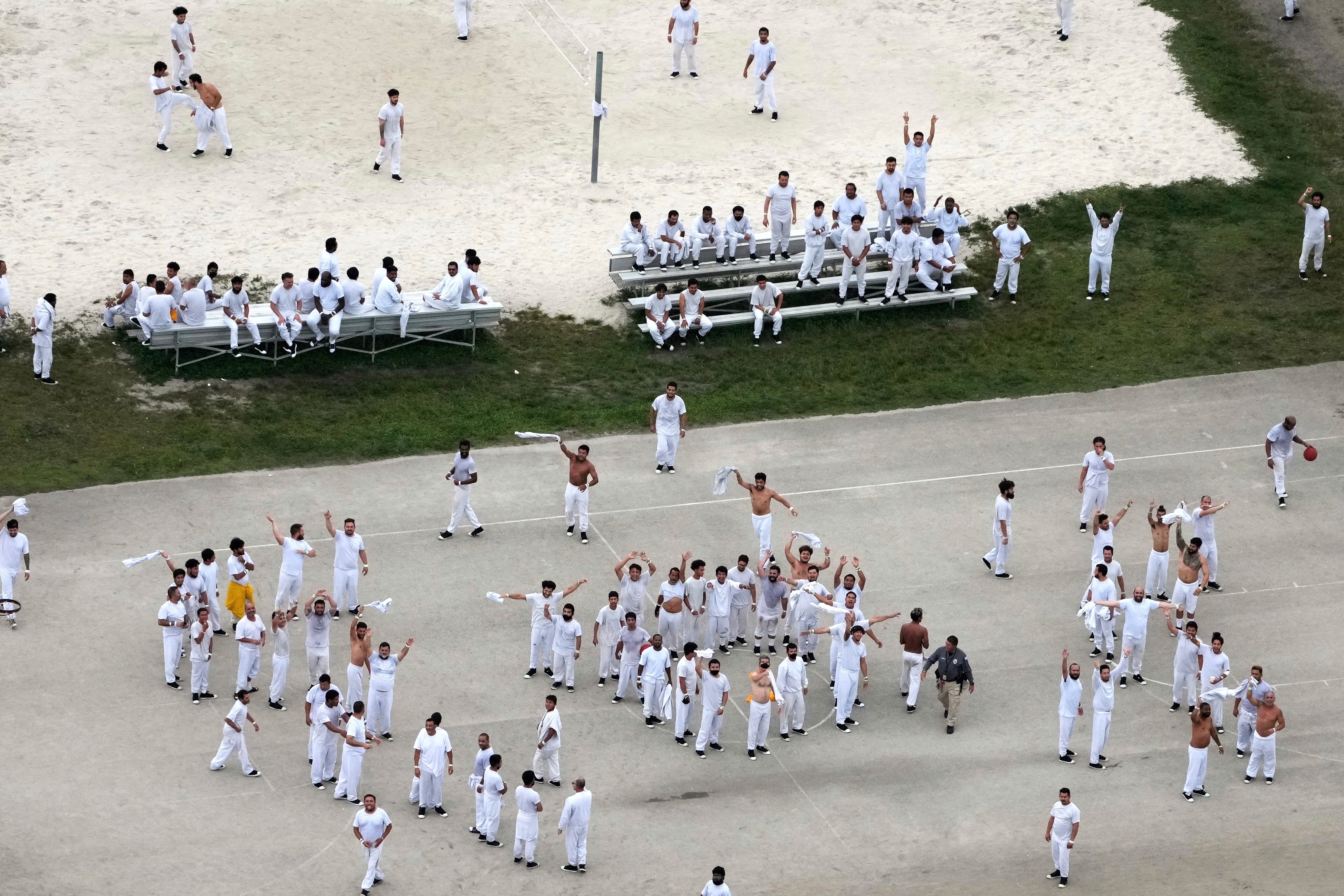 Detainees wave and spell out a rough SOS to a helicopter flying overhead, at U.S. Immigration and Customs Enforcement's Krome Detention Center in Miami