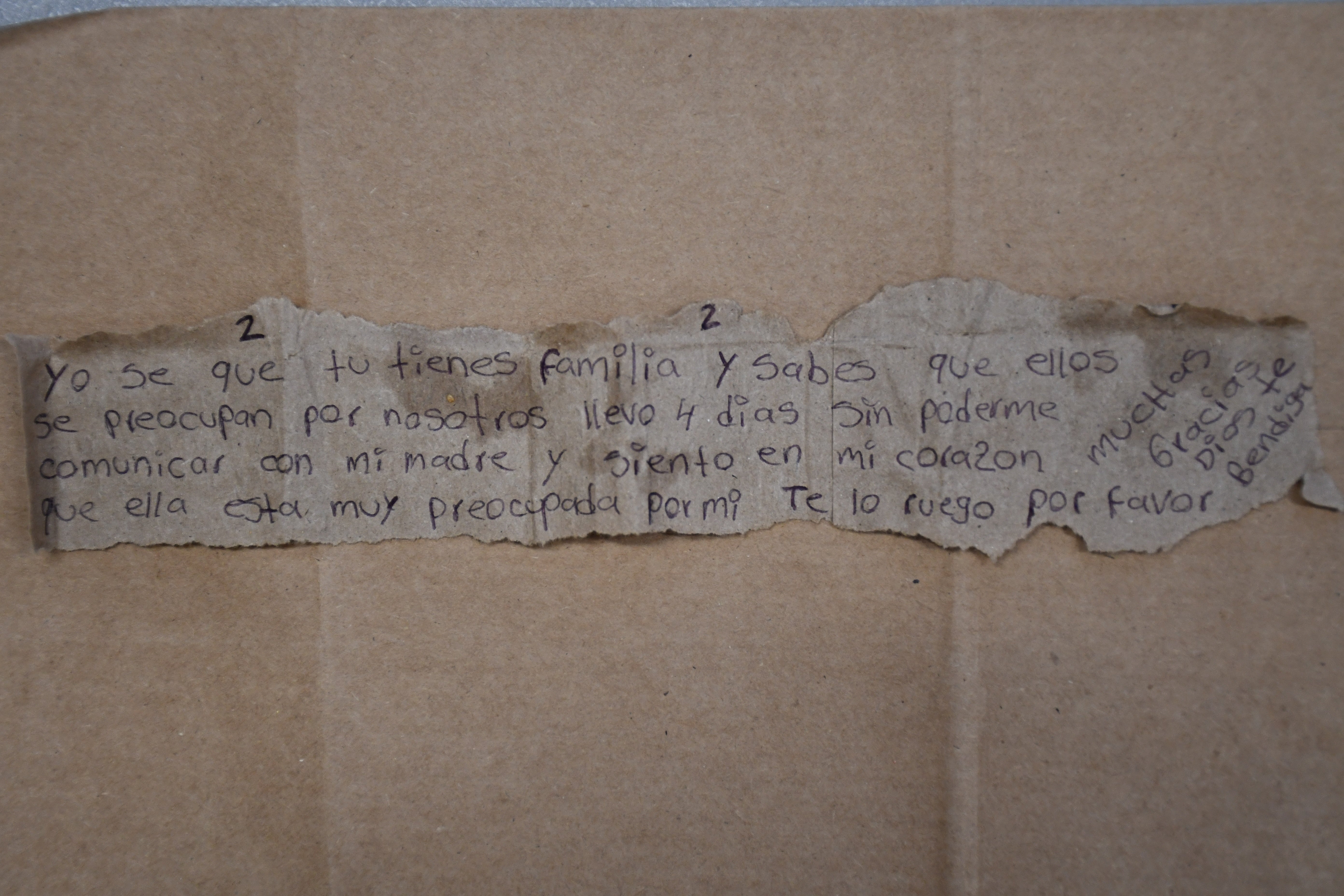 This photo provided by the Missouri State Highway Patrol shows a note written in Spanish by Immigration and Customs Enforcement detainee Brayan Rayo Garzon asking for a phone call with his mother, while he was in the Phelps County jail