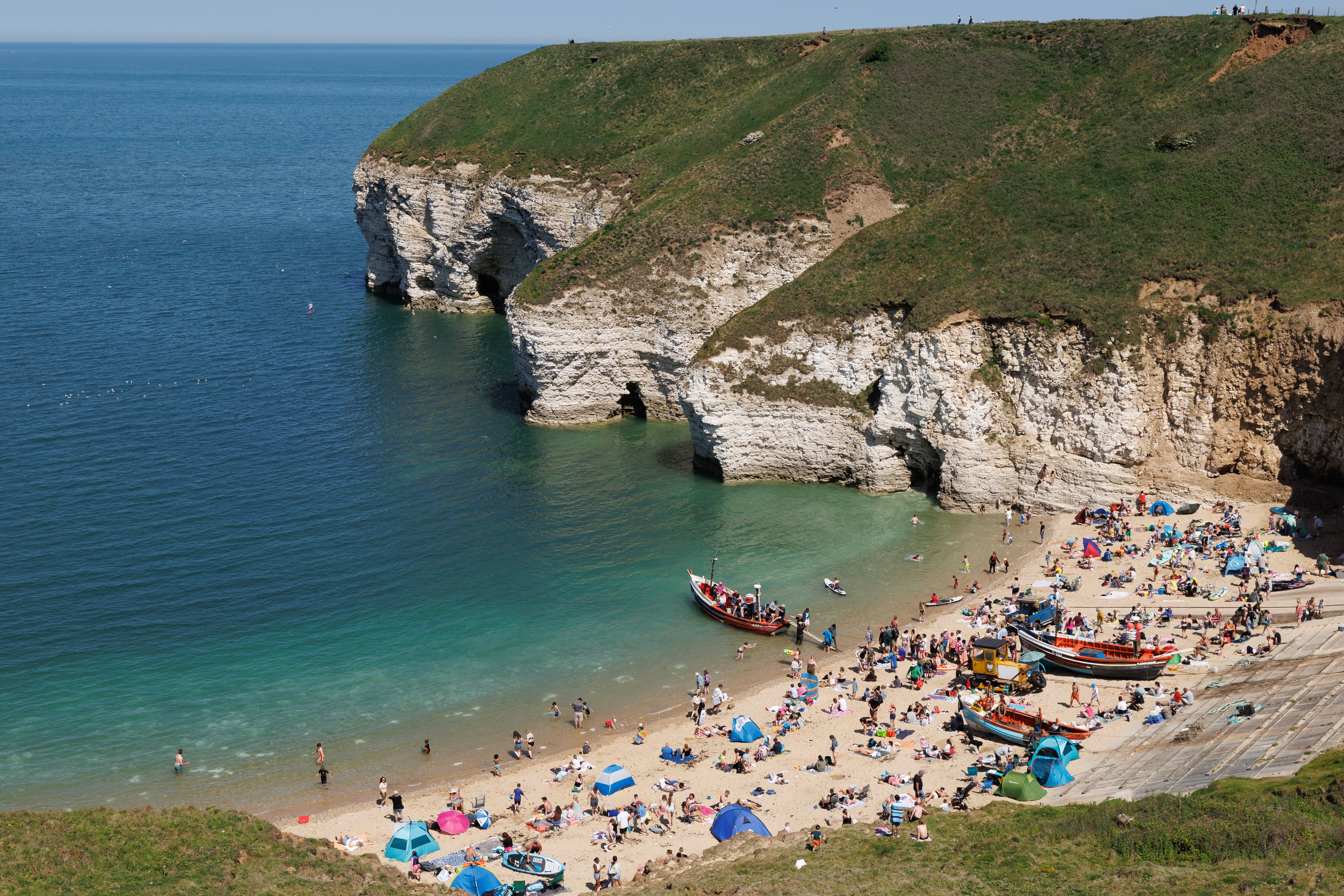 Beachgoers enjoy the hot weather at Flamborough's North Landing beach on May 26, 2026