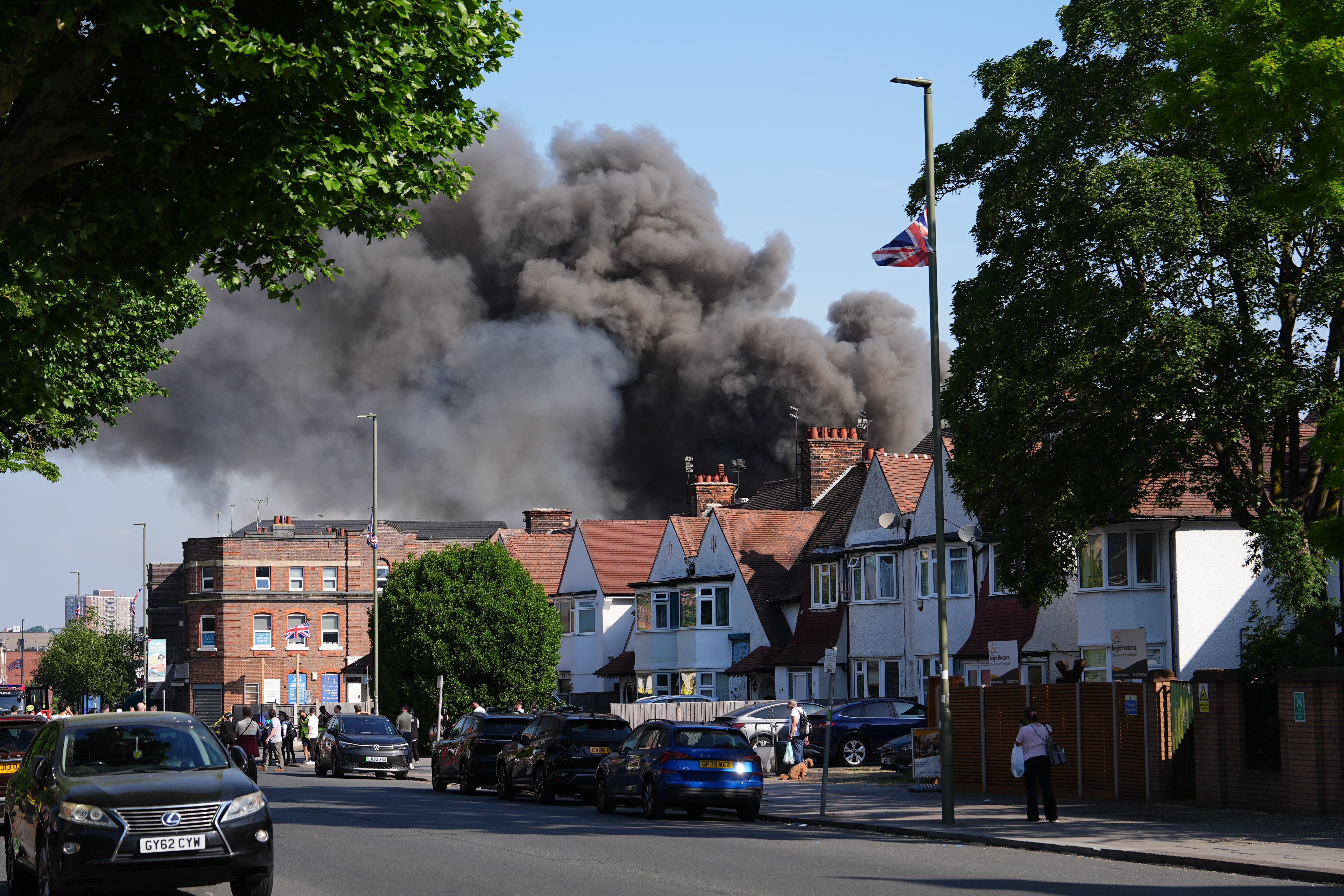 Fire rising from the building on Wednesday morning (PA)
