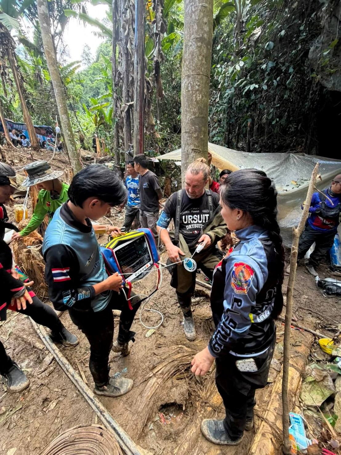 Members of a rescue team work to save seven people trapped in a cave, at a location given as Xaisomboun Province, Laos, in this handout image released 26 May 2026