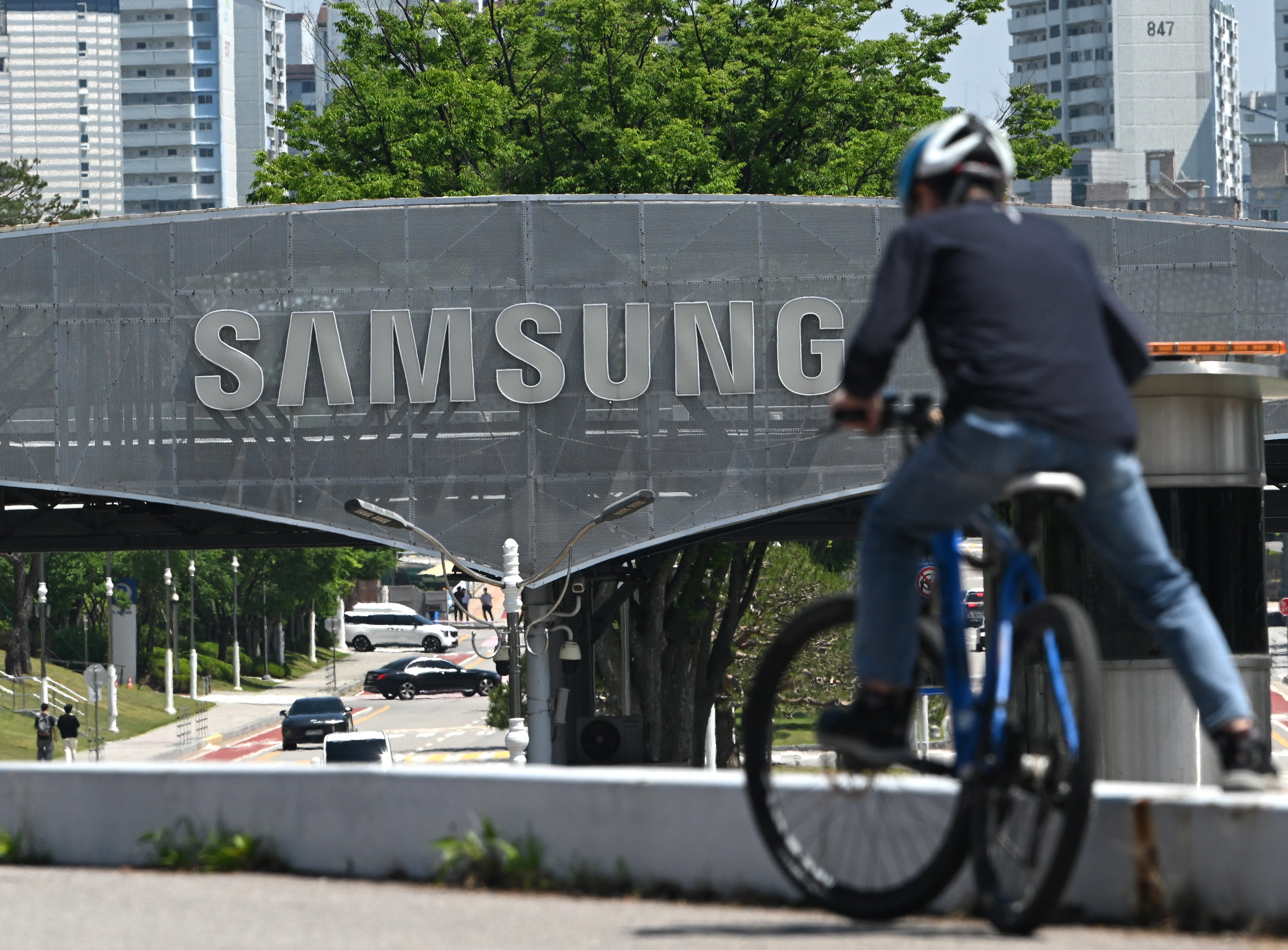 The logo of Samsung Electronics is seen on a gate at the company's headquarters in Suwon on May 22
