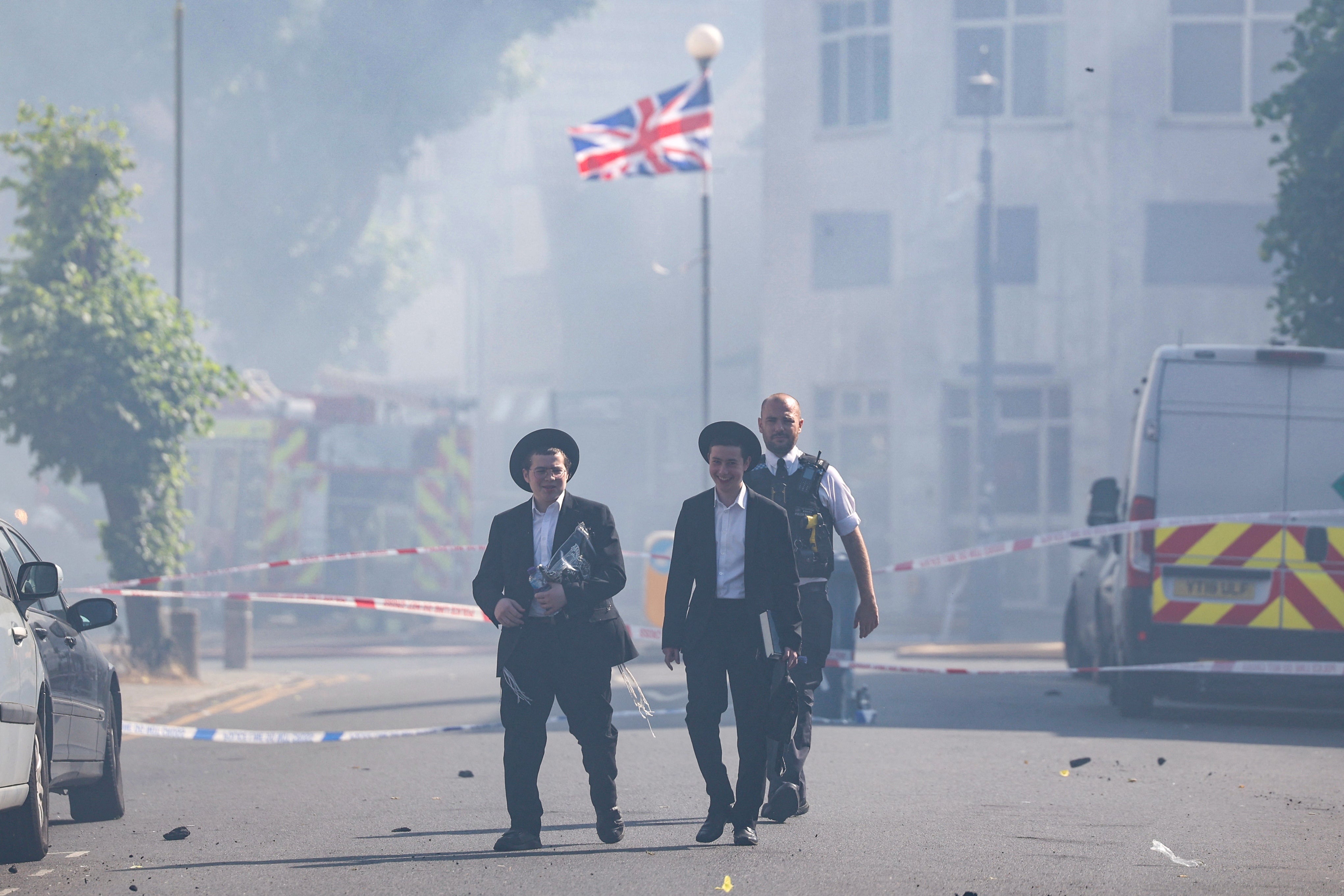 Members of the Jewish community at the scene (AFP/Getty)