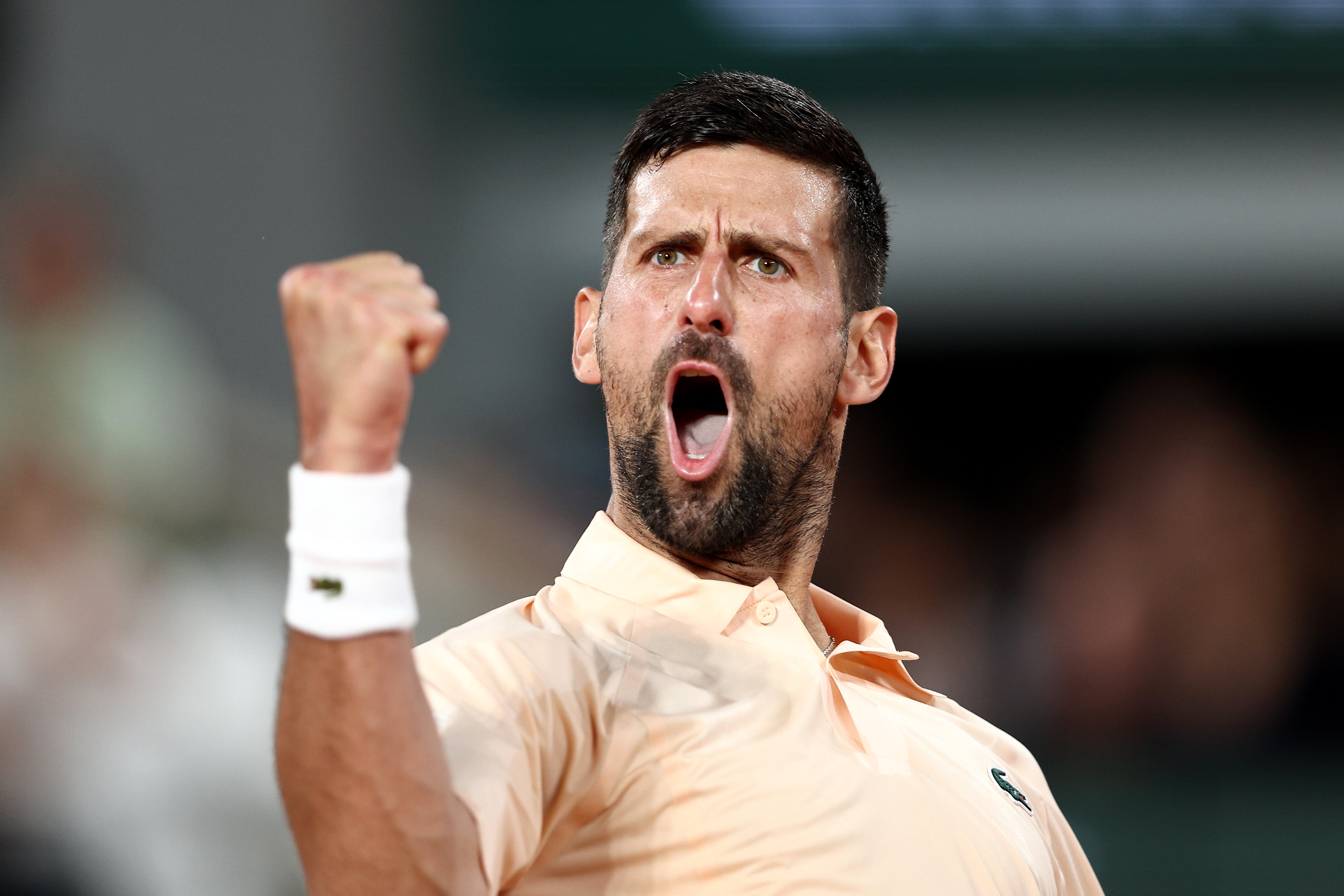 Novak Djokovic of Serbia celebrates against Giovanni Mpetshi Perricard of France in their Men's Singles first round match