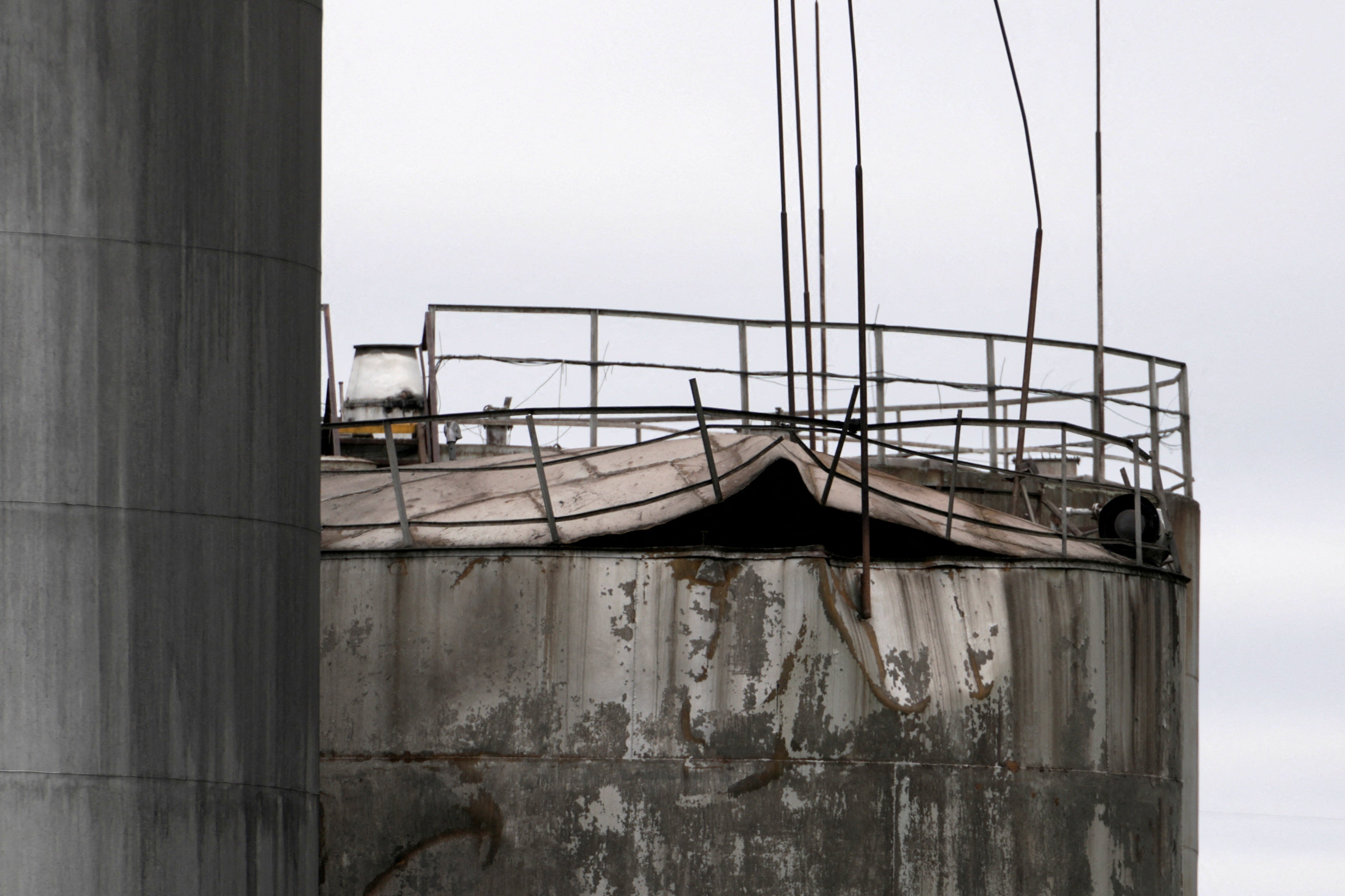 Damage to an oil tank after drones crashed at a storage facility in Rezekne, Latvia, May 7 (Reuters)