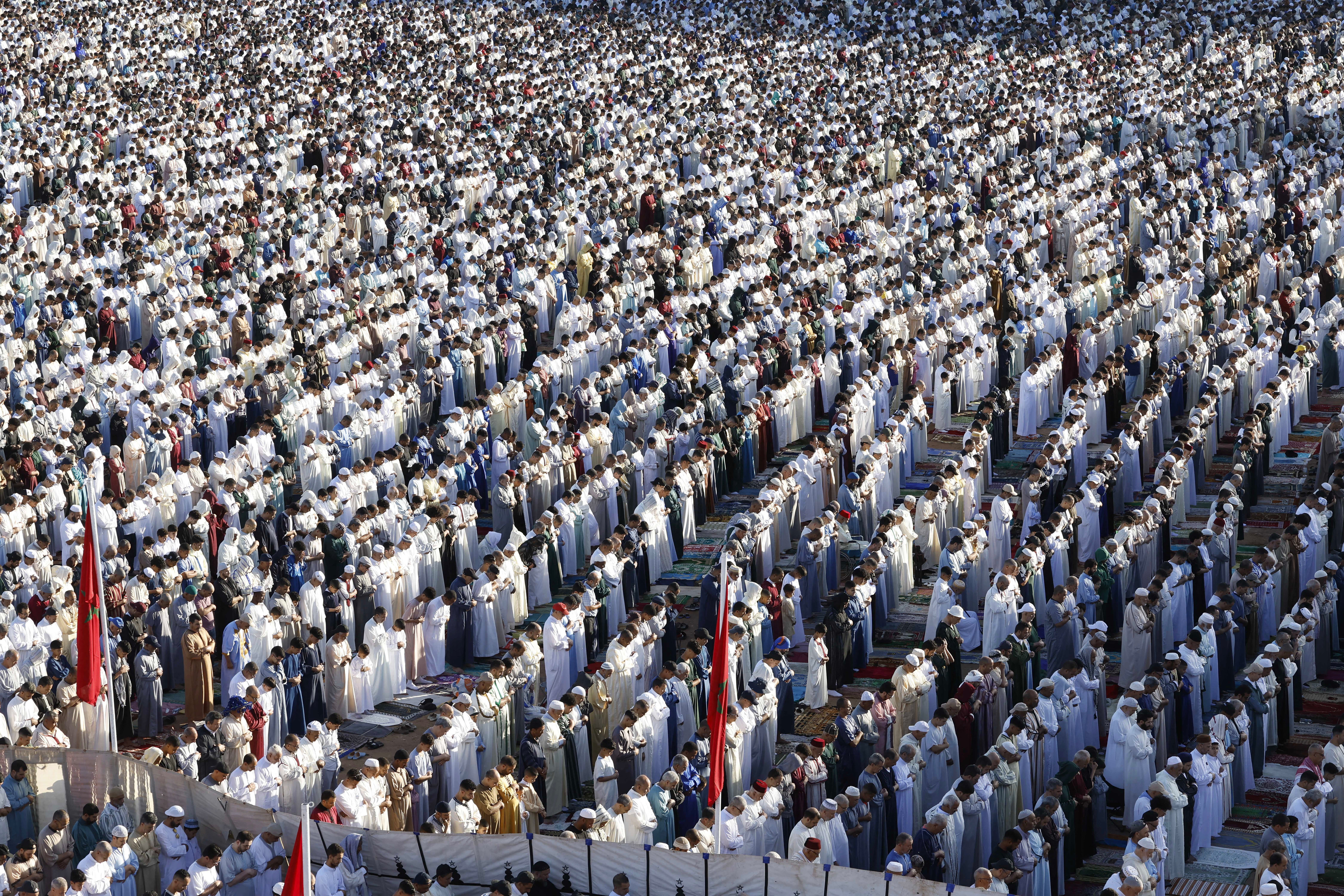 Muslim worshippers perform morning prayers marking the start of Eid al-Adha, the Feast of Sacrifice, in open-air prayer grounds in Salé on 27 May 2026
