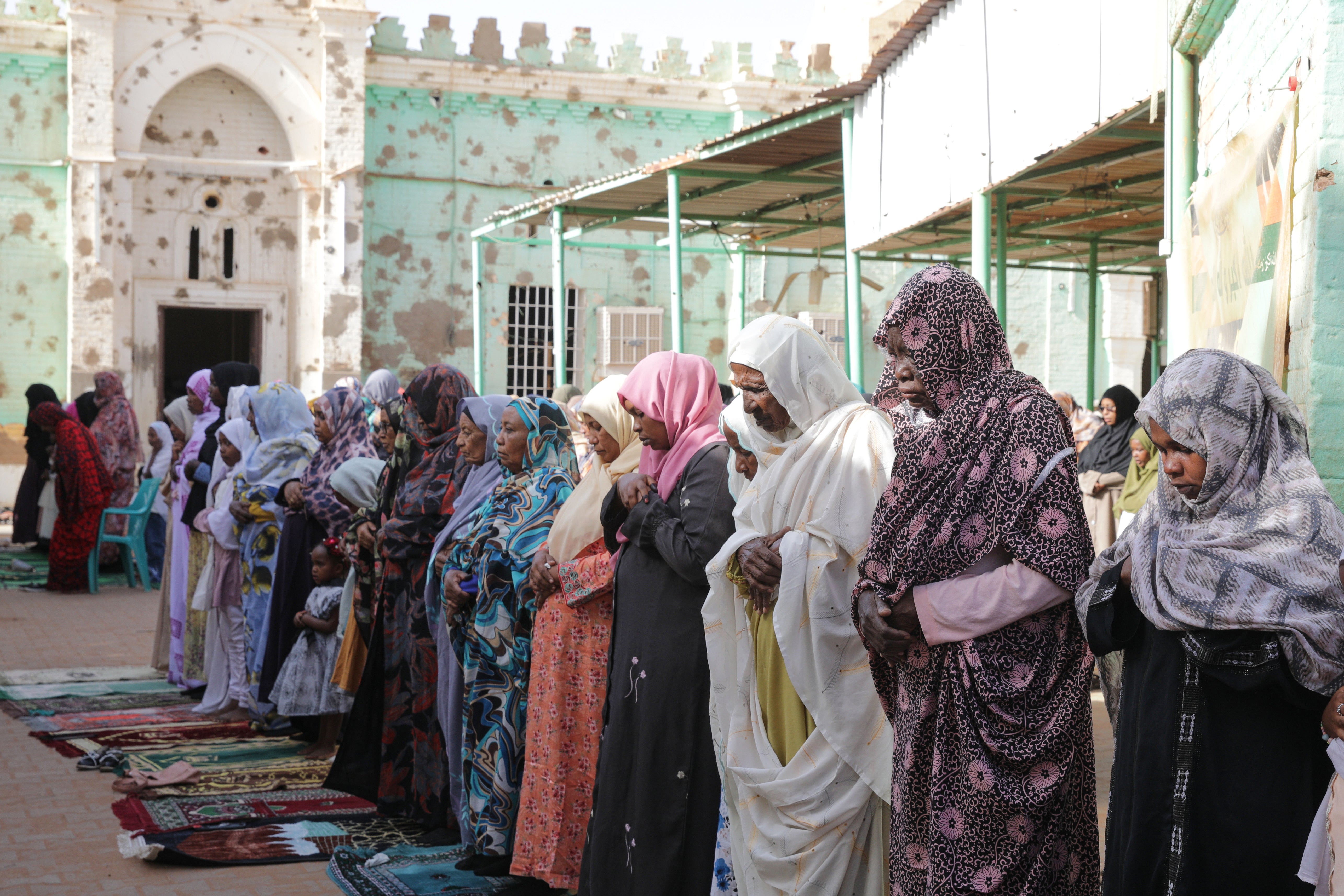 Muslim worshippers pray during Eid al-Adha prayers, at a war-damaged Al-Sayyid Abdul Rahman al-Mahdi mosque, in Khartoum, Sudan, Wednesday, 27 May 2026