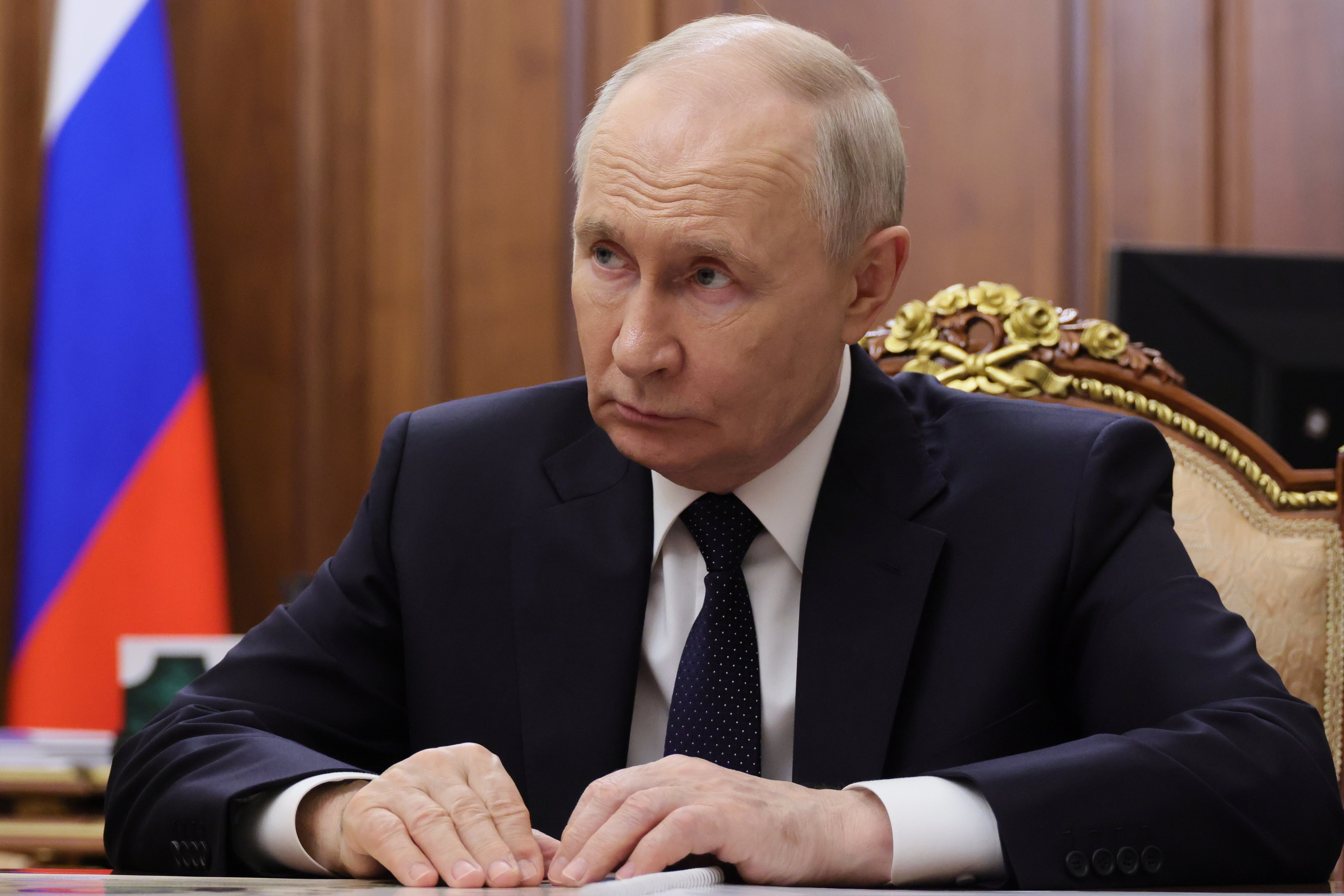 Russian President Vladimir Putin listens to Deputy Prime Minister Dmitry Patrushev, during their meeting at the Kremlin in Moscow